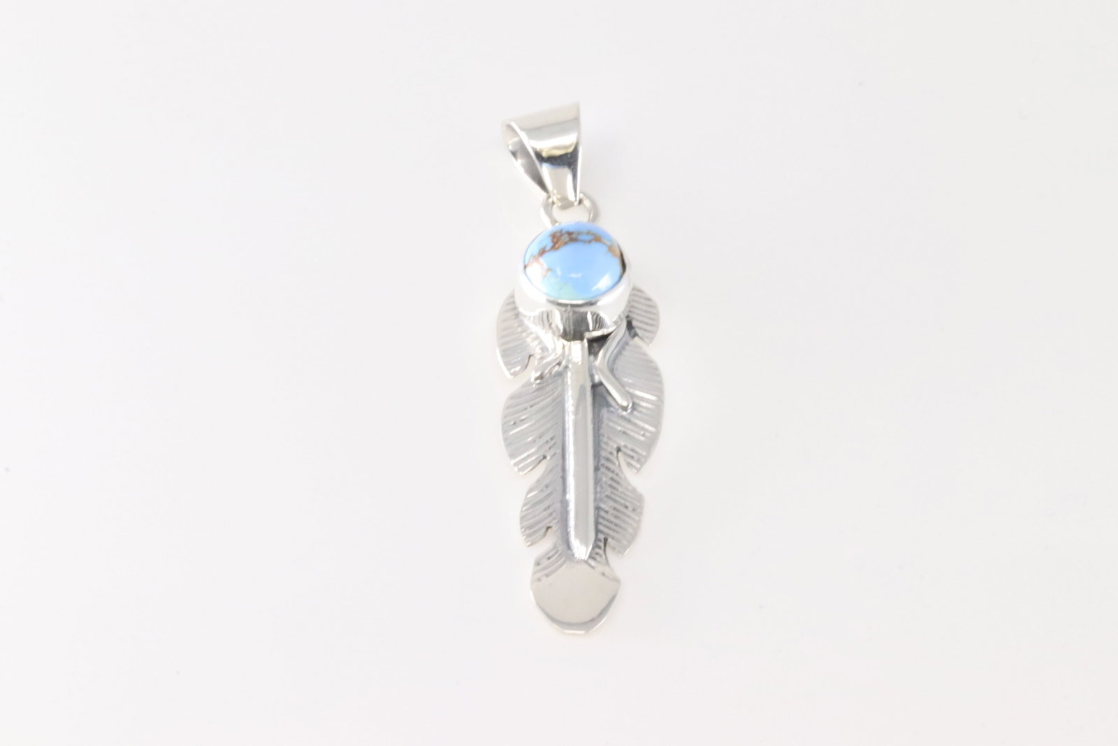 Native America Navajo Sterling Silver Golden Hill Turquoise Feather Pendant By June Delgarito.: This is a Native America Navajo Sterling Silver Golden Hill Turquoise Feather Pendant By June Delgarito.