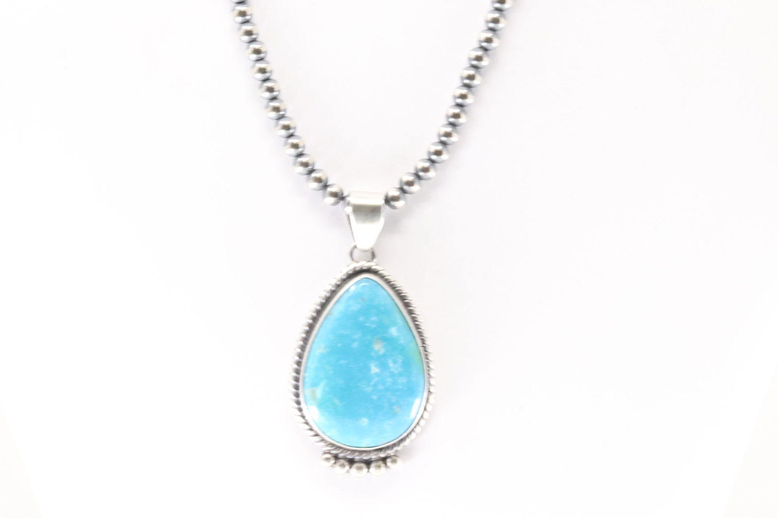 Native America Navajo Sterling Silver Kingman Turquoise Pendant By Judith Dixon. With Pearl Beaded: This is a Native America Navajo Sterling Silver Kingman Turquoise Pendant By Judith Dixon. With Pearl Beaded Sterling Silver Machine Made Necklace. Necklace length: 16.00"