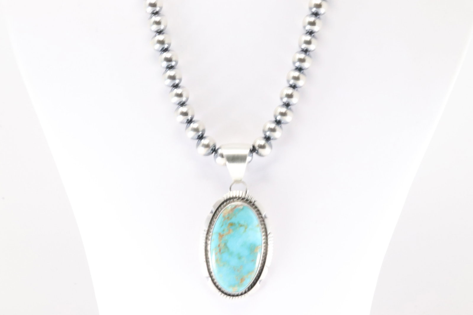 Native America Navajo Sterling Silver Kingman Turquoise Pendant By Alfred Martinez. With Pearl: This is a Native America Navajo Sterling Silver Kingman Turquoise Pendant By Alfred Martinez. With Pearl Beaded Sterling Silver Machine Made Necklace. Necklace length: 18.00"