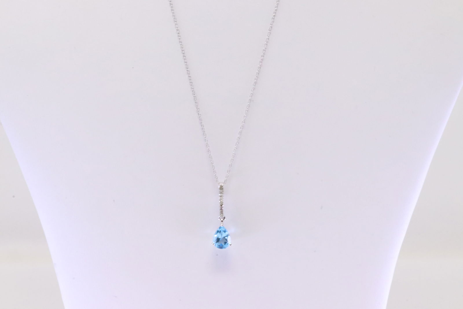 Diamond & Blue Topaz Pendat / Necklace 10Kt.: 10Kt White Gold Diamond & Blue Topaz Pendant / Necklace. Pendant has 9 round Diamonds. With Teardrop Blue Topaz & A Necklace. Diamonds weight: 0.0ctw. Necklace length: 18.00"
