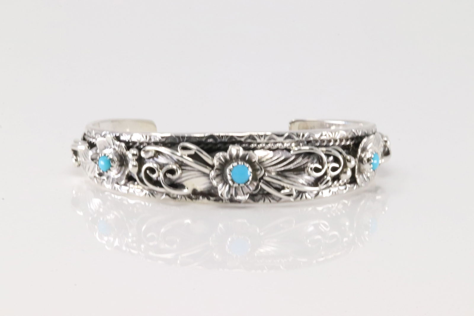 Native America Navajo Sterling Silver Turquoise Bracelet Floral Cuff By B.J.: This is a Native America Navajo Sterling Silver Turquoise Bracelet Floral Cuff By B.J.