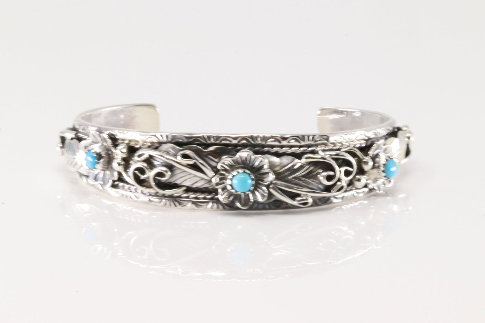 Native America Navajo Sterling Silver Turquoise Bracelet Floral Cuff By B.J.: This is a Native America Navajo Sterling Silver Turquoise Bracelet Floral Cuff By B.J.