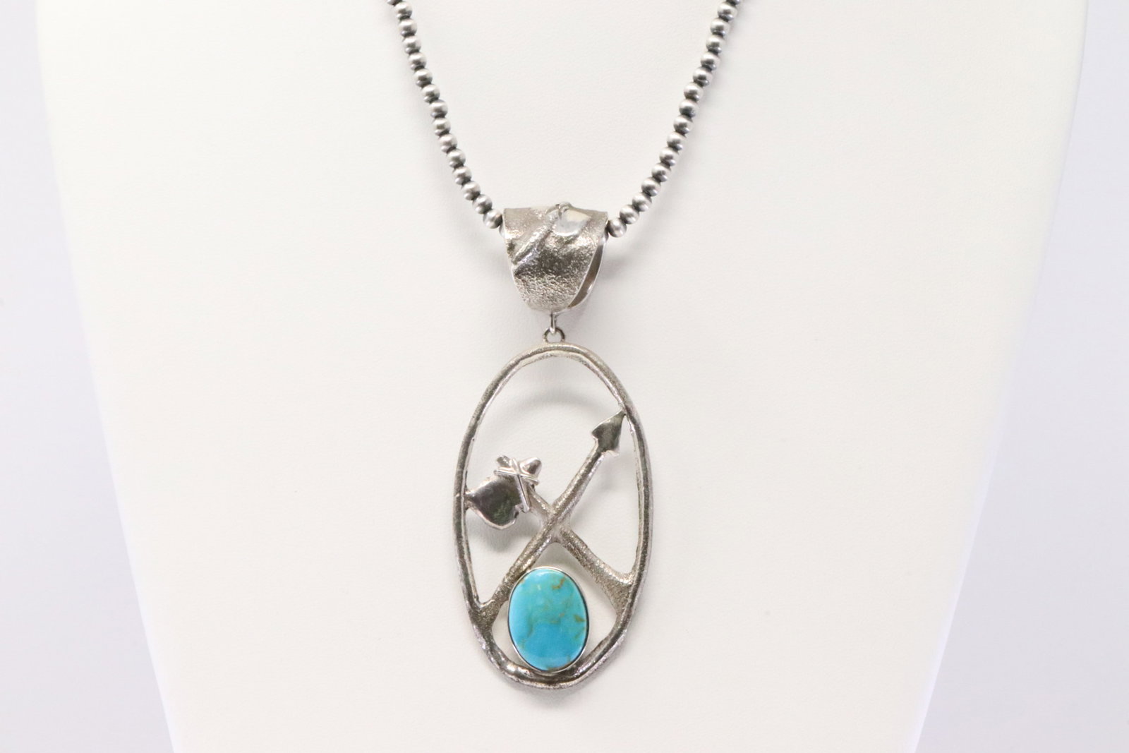 Native America Navajo Sterling Silver Turquoise Pendant By Ghassasn. With Pearl Beaded Sterling: This is a Native America Navajo Sterling Silver Turquoise Pendant By Ghassasn. With Pearl Beaded Sterling Silver Machine Made Necklace. Necklace length: 16.00"