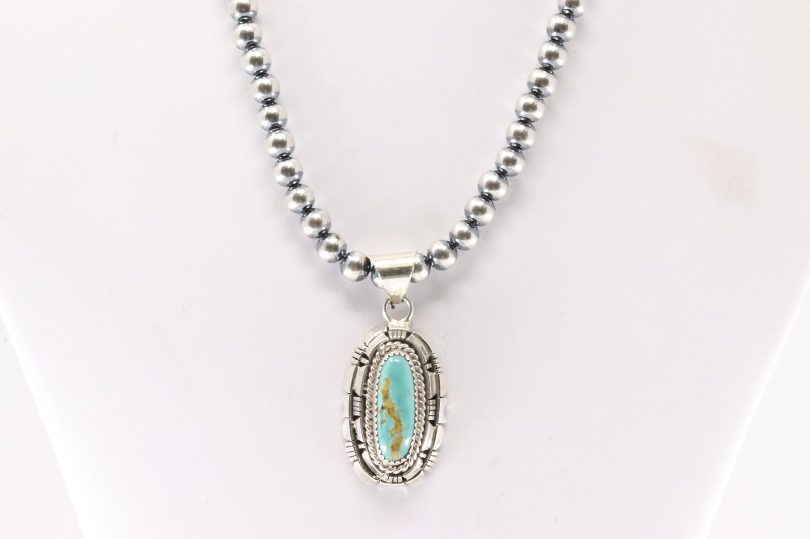 Native America Navajo Sterling Silver Kingman Turquoise Pendant By Wiliam Begay. With Pearl Beaded: This is a Native America Navajo Sterling Silver Kingman Turquoise Pendant By Wiliam Begay. With Pearl Beaded Sterling Silver Machine Made Necklace. Necklace length: 16.00"