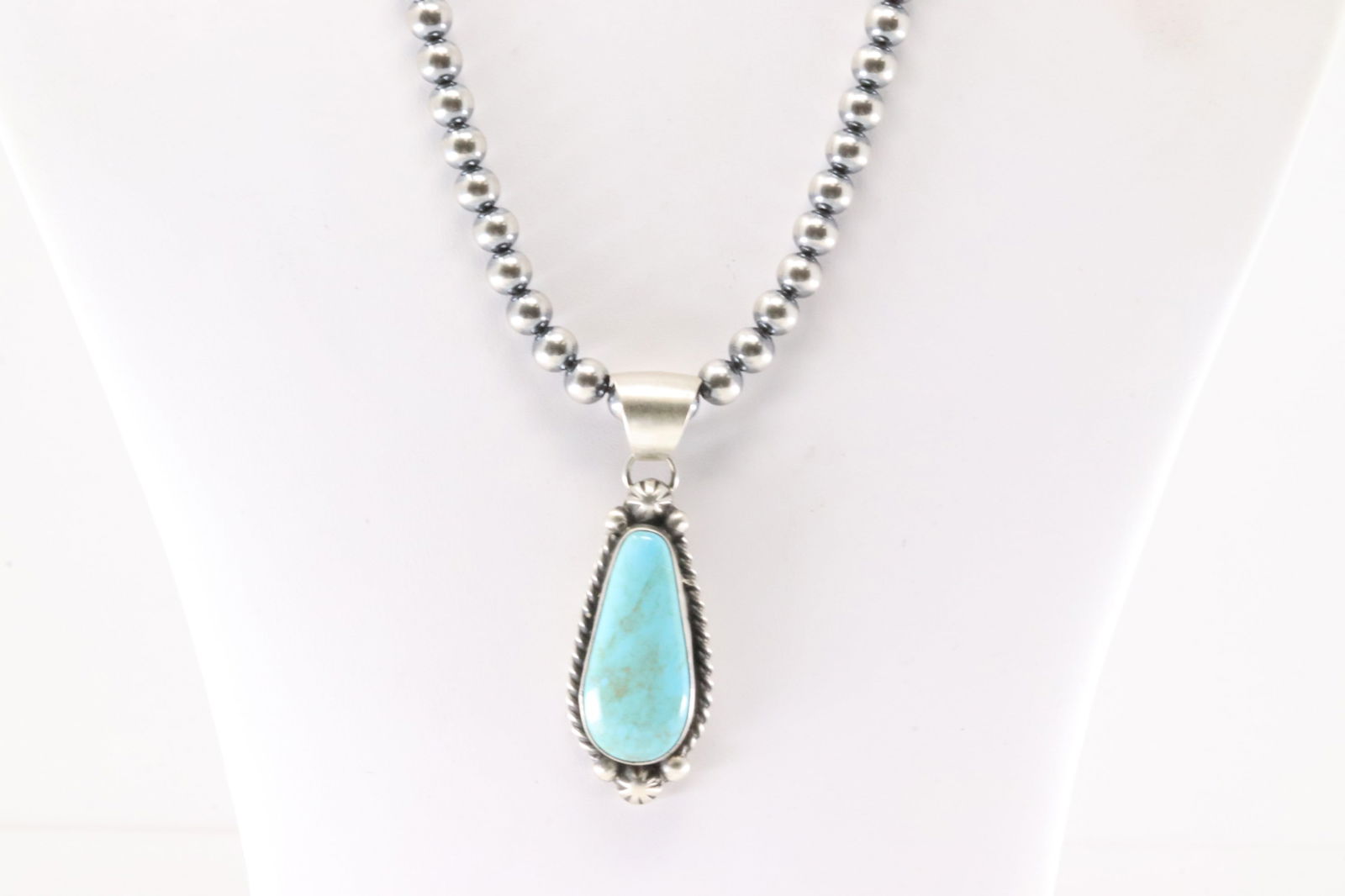 Native America Navajo Sterling Silver Kingman Turquoise Pendant By Augustine Largo. With Pearl: This is a Native America Navajo Sterling Silver Kingman Turquoise Pendant By Augustine Largo. With Pearl Beaded Sterling Silver Machine Made Necklace. Necklace length: 18.00"