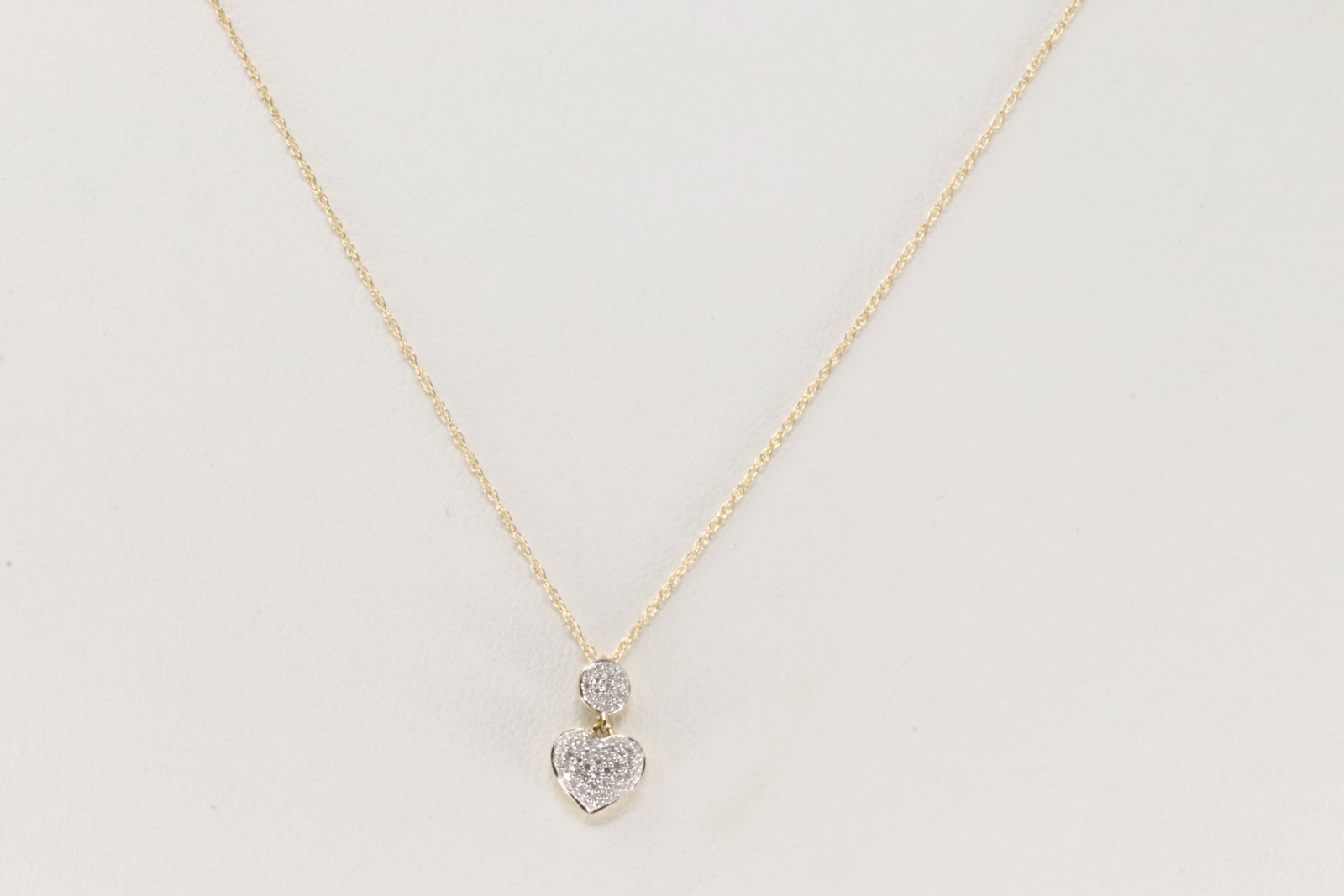 Diamond Heart Pendant / Necklace 14Kt.: 14Kt Yellow Gold Diamond Heart Pendant / Necklace. This heart pendant has 74 accent diamonds with a 14k necklace. Diamonds weight approx: 0.12ctw. Necklace length: 18.00"