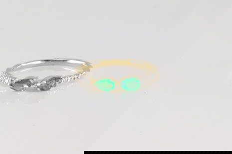 Emerald & Diamond Ring14Kt.: Ladies 14Kt Yellow Gold Emerald & Diamond Ring. This beautiful ring has 2 pear-shape emerald's with 10 round diamonds. Emerald weight approx: 0.41ctw. Diamonds weight approx: 0.06ctw. Ring size: .75.