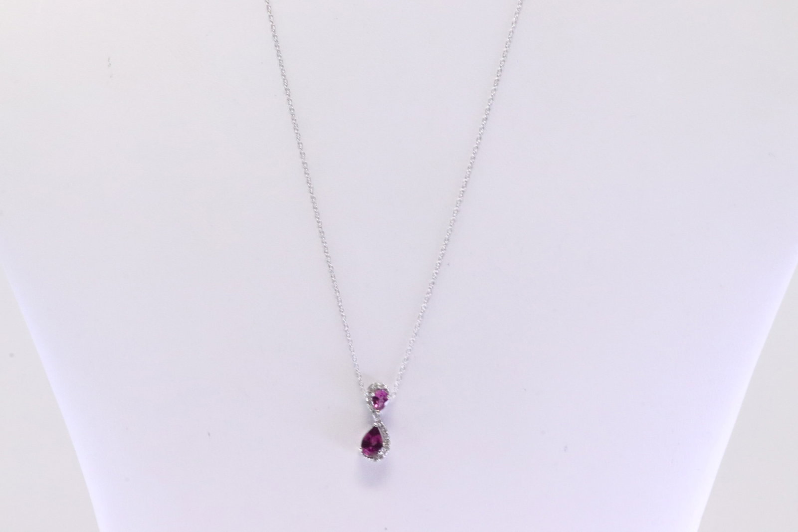 Garnet & Diamond Pendant / Necklace 10Kt.: Ladies 10Kt White Gold Garnet & Diamond Pendant / Necklace. Necklace has one Pendant with Garnet & round Diamonds. Diamonds weight: 0.08ctw. Necklace length: 18.00"