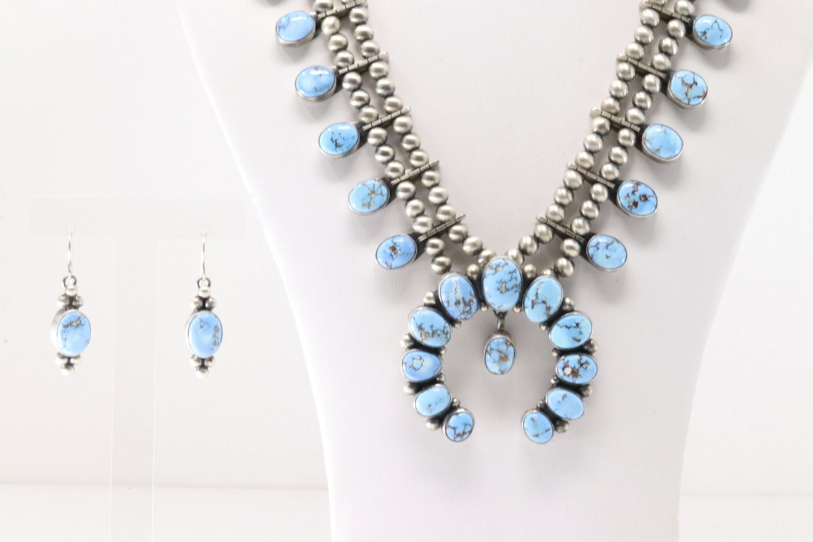Native America Navajo Sterling Silver Golden Hill Turquoise Squash Blossom Necklace & Earring's Set: This is a Native America Navajo Sterling Silver Golden Hill Turquoise Squash Blossom Necklace & Earring's Set By T. Necklace length: 30.00" Total weight: 160.00 Grams.