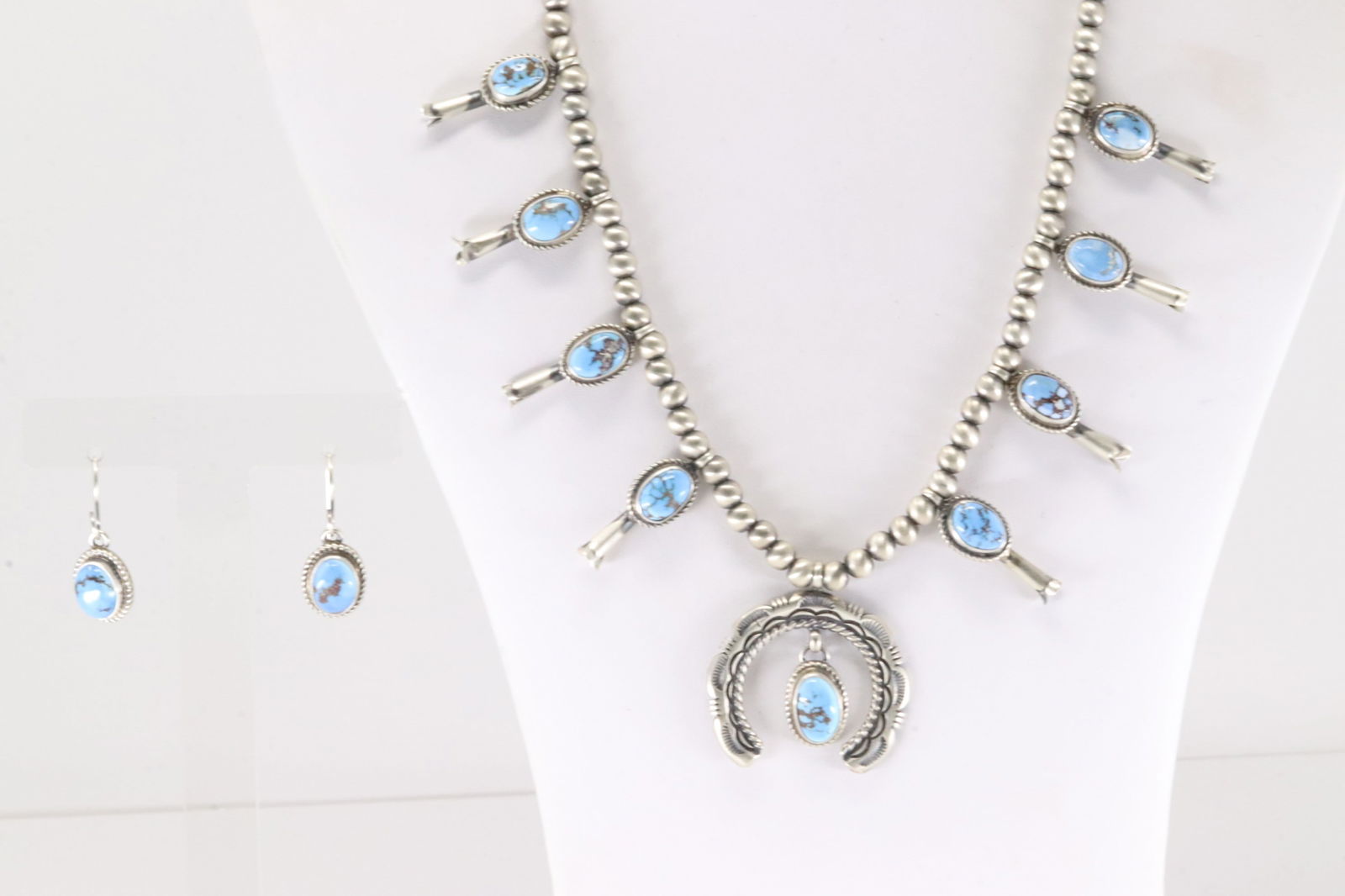 Native America Navajo Sterling Silver Golden Hill Baby Squash Blossom Necklace & Earring's Set By: This is a Native America Navajo Sterling Silver Golden Hill Baby Squash Blossom Necklace & Earring's Set By S.H. Necklace length: 20.00"