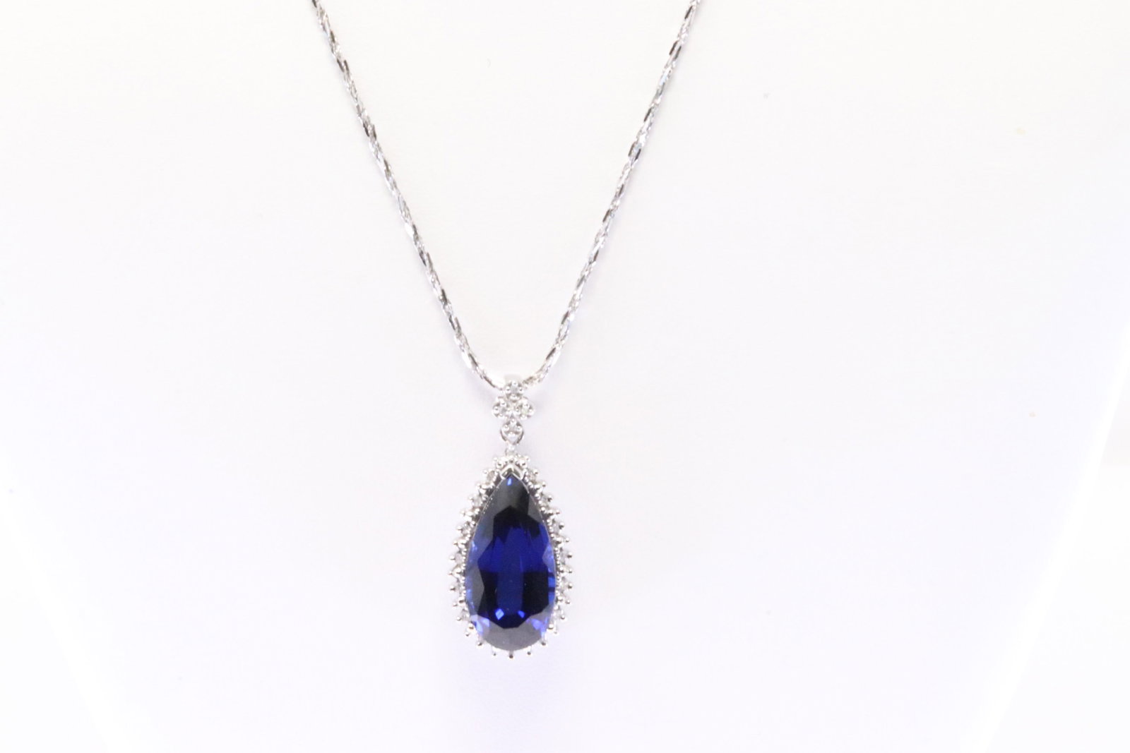Sapphire & Diamond Pendant: Ladies 10Kt White Gold Sapphire & Diamond Pendant Pendant has Elegant Teardrop Sapphire Gemstone with round Diamonds & a 14K White Necklace. Diamonds weight approx: 0.50ctw.Necklace length: 18.00" Tot