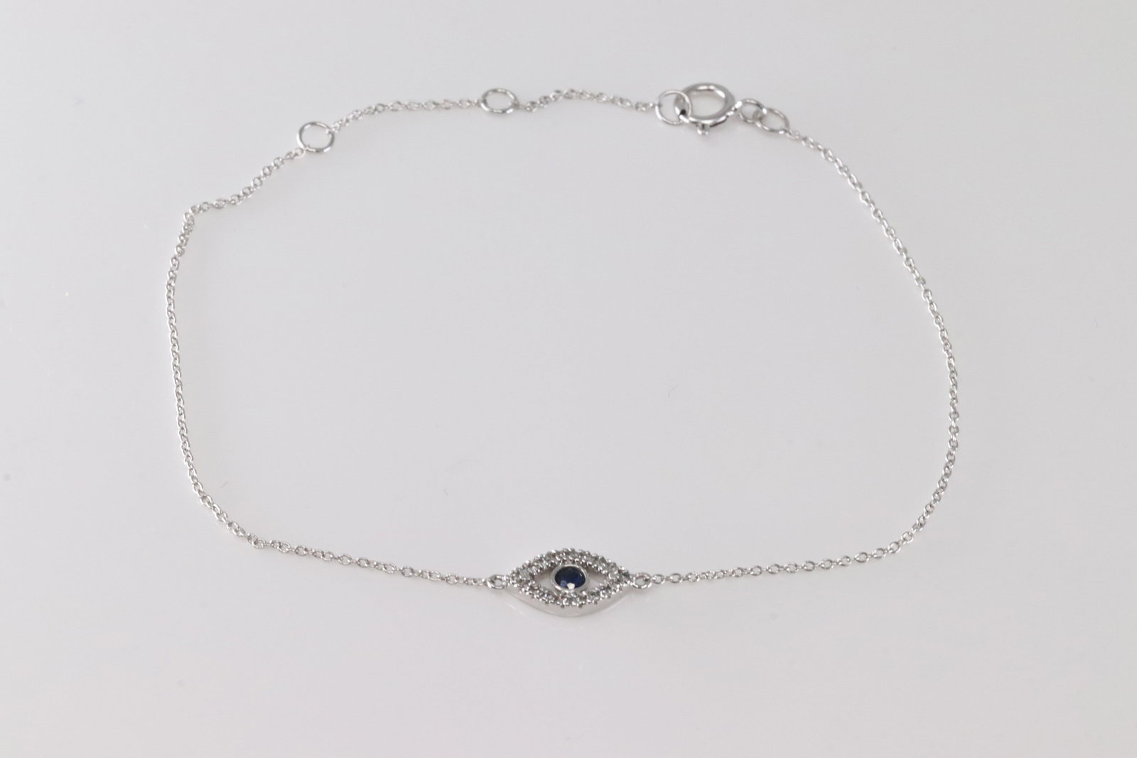 Sapphire & Diamond Bracelet 14kt.: Ladies 14kt White Gold Sapphire & Diamond Bracelet. This Bracelet has A Beautiful Sapphire In the Middle Surrender By 18 Round Sparkling Diamonds. Sapphire Weight: 0.06ctw. Diamond Weight: 0.06ctw. Br