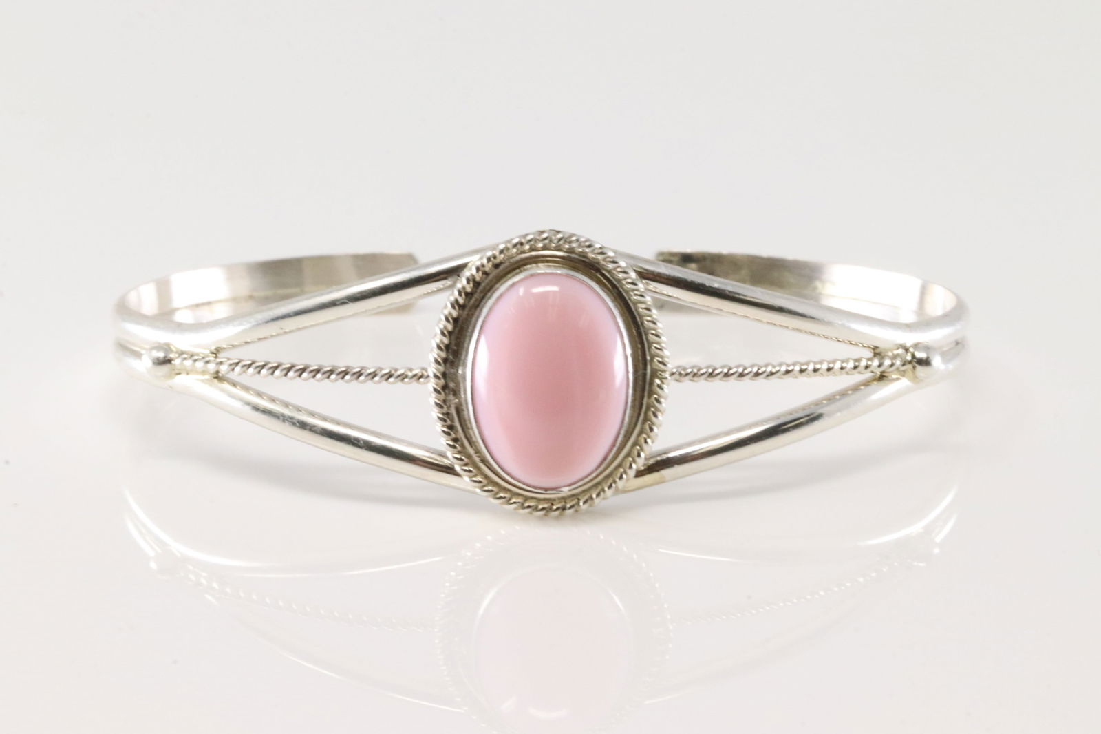 Native America Navajo Sterling Silver Pink Conch Shell Bracelet Cuff By P.Skeets.: This is a Native America Navajo Sterling Silver Pink Conch Shell Bracelet Cuff By P.Skeets.