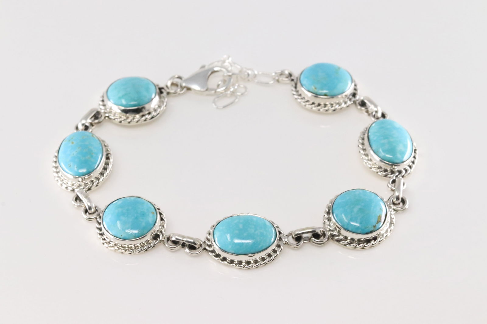 Native America Navajo Sterling Silver Turquoise Bracelet Link By Arlene Lewis.: This is a Native America Navajo Sterling Silver Turquoise Bracelet Link By Arlene Lewis. Bracelet length: 10.00" Adjustable.