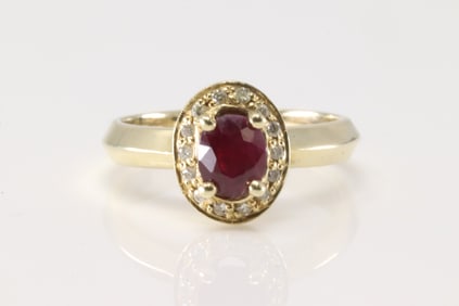 Ruby & Diamond Ring 14Kt. Ladies 14kt Yellow Gold Ruby & Diamond Ring. This charming ring has oval