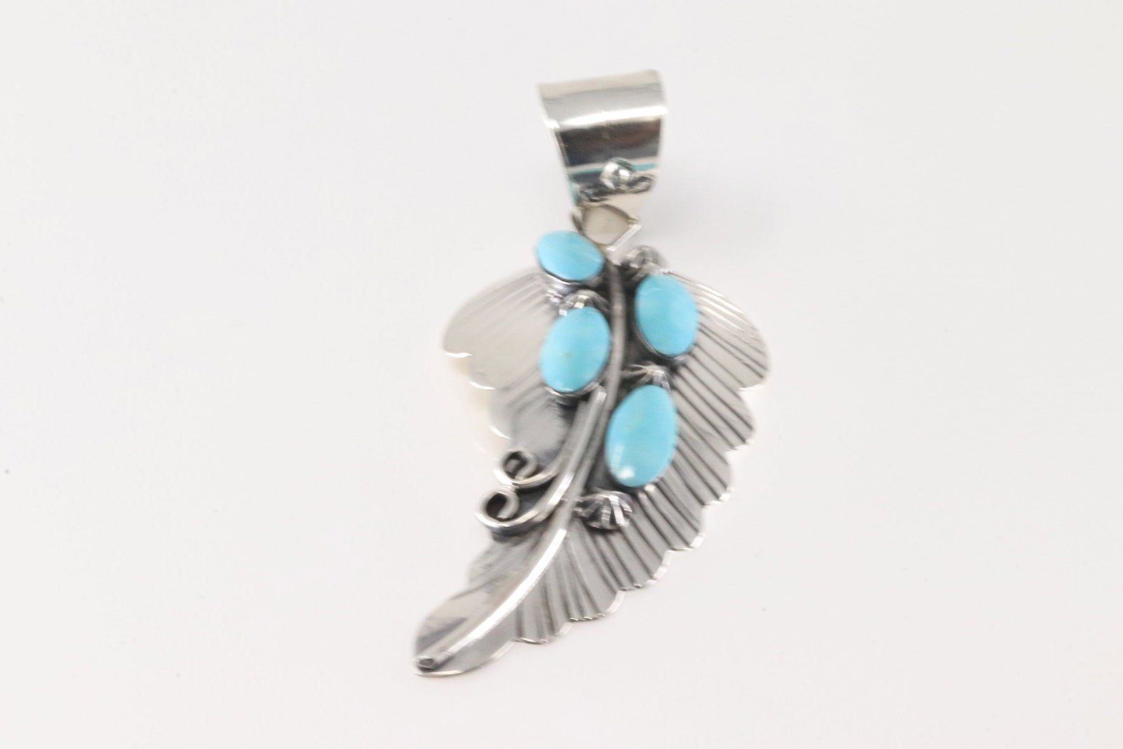 Native America Navajo Sterling Silver Turquoise Leaf Pendent By Raymond Yazzie.: This is a Native America Navajo Sterling Silver Turquoise Leaf Pendent By Raymond Yazzie.