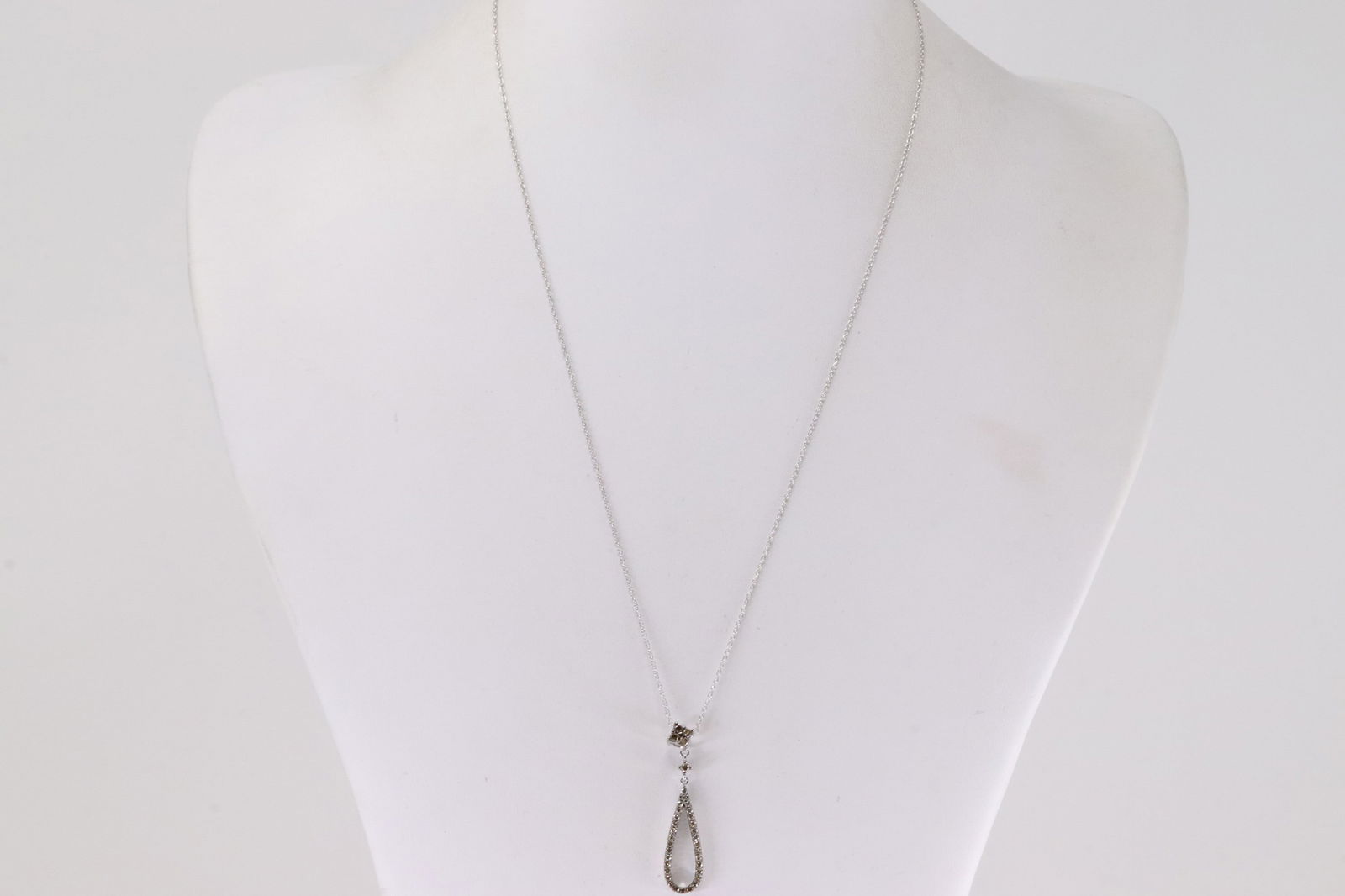 Champagne Diamond Pendant / Necklace 10Kt.: Ladies 10Kt White Gold Champagne Diamond Pendant / Necklace. This Charming Pear-Shape Pendant has Champagne Diamonds and A 10k Necklace. Diamonds weight: 0.45ctw. Necklace length: 18.00"