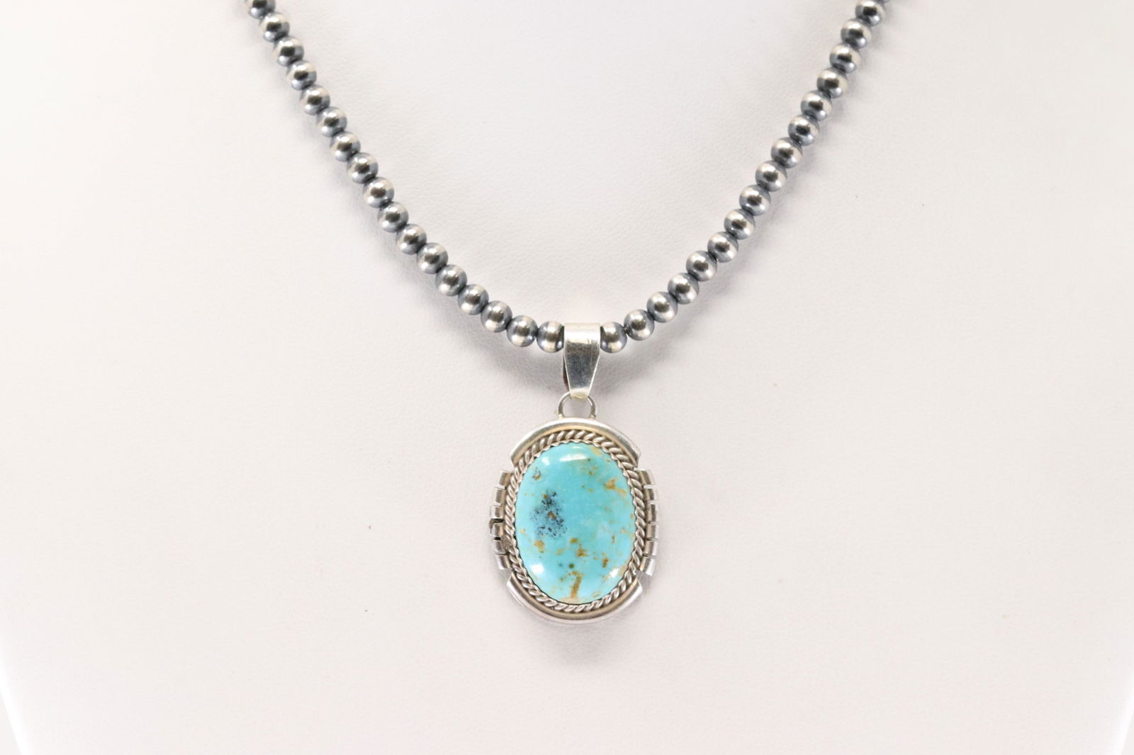 Native America Navajo Sterling Silver Kingman Turquoise Pendant By Freda Martinez. With Pearl Beaded: This is a Native America Navajo Sterling Silver Kingman Turquoise Pendant By Freda Martinez. With Pearl Beaded Sterling Silver Machine Made Necklace. Necklace length: 14.00"