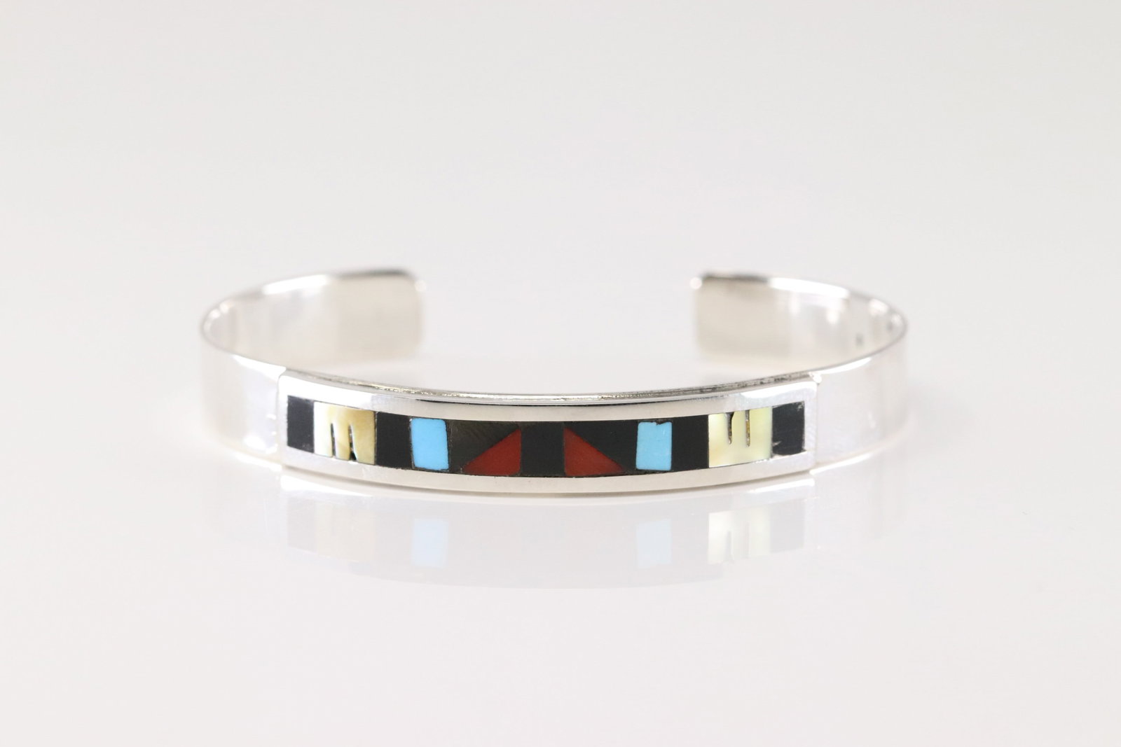 Native America Zuni Sterling Silver Multi-Color Stone Inlay Bracelet Cuff By Leander Othole.: This is a Native America Zuni Sterling Silver Multi-Color Stone Inlay Bracelet Cuff By Leander Othole.