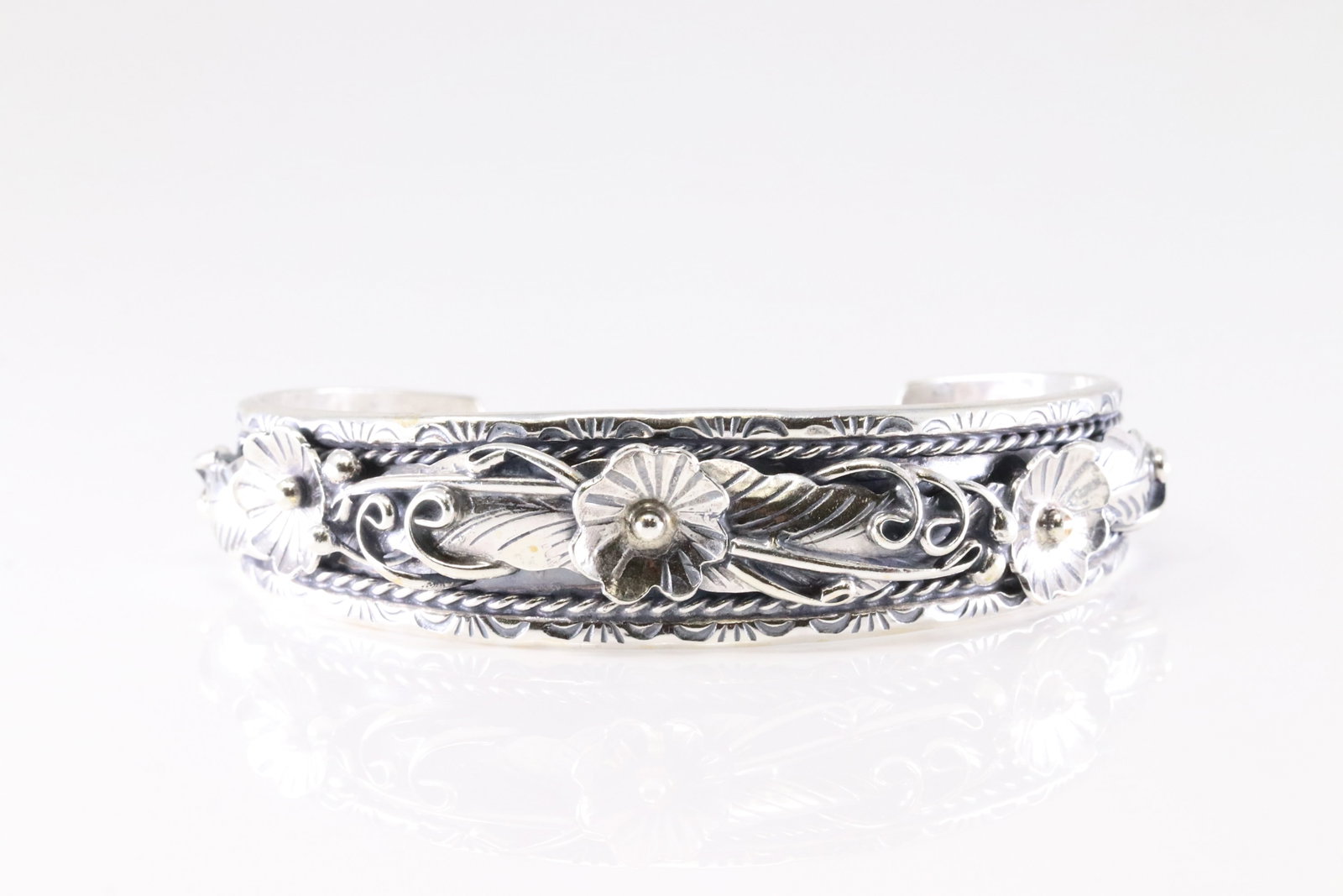 Native America Navajo Sterling Silver Bracelet Floral Cuff By Bessie Joe.: This is a Native America Navajo Sterling Silver Bracelet Floral Cuff By Bessie Joe.