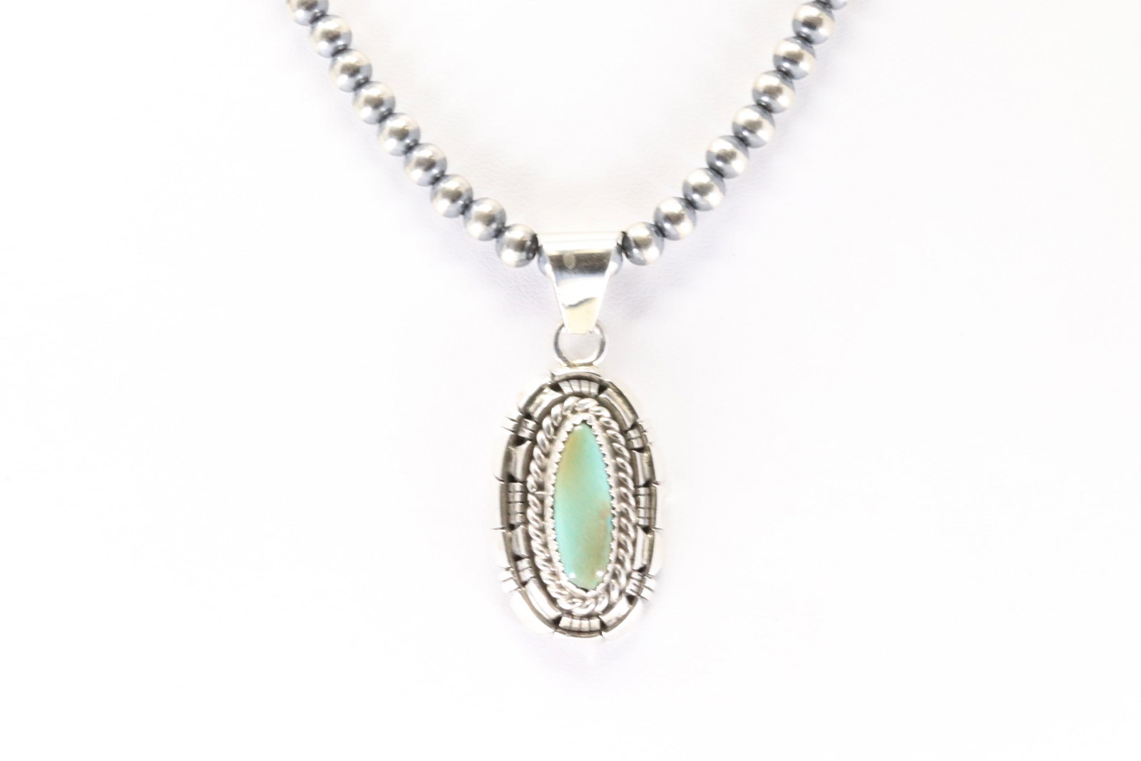 Native America Navajo Sterling Silver Kingman Turquoise Pendant By William Begay. With Pearl Beaded: This is a Native America Navajo Sterling Silver Kingman Turquoise Pendant By William Begay. With Pearl Beaded Sterling Silver Machine Made Necklace. Necklace length: 14.00"