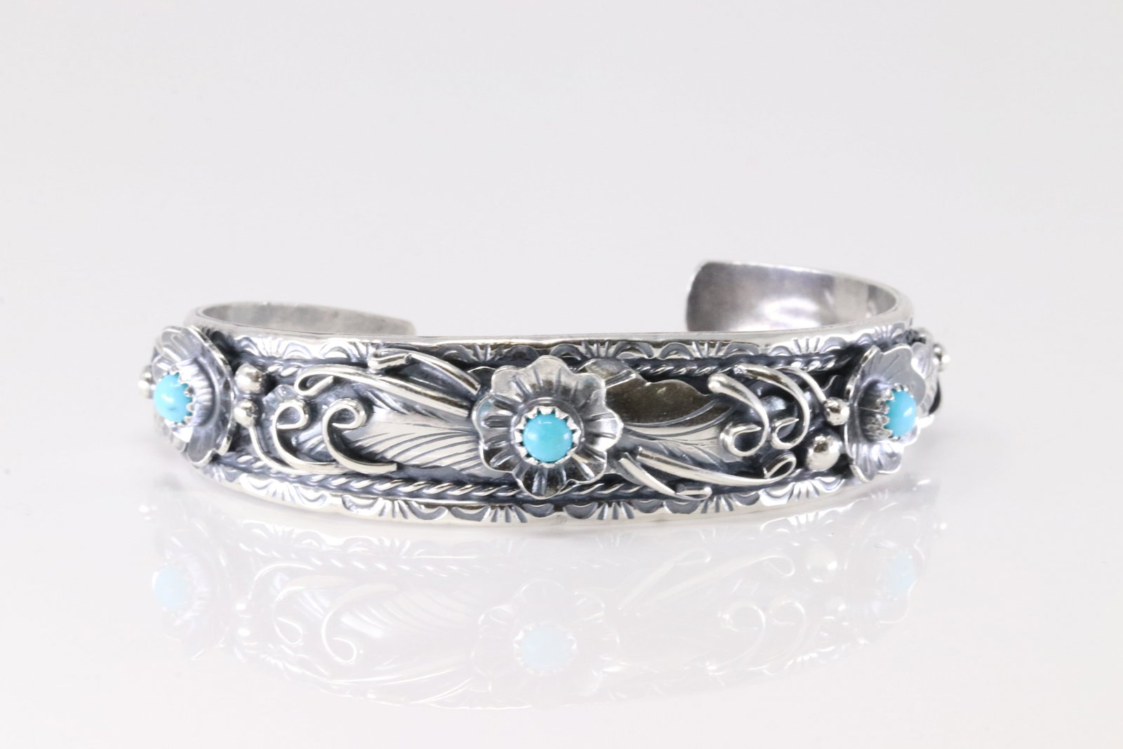 Native America Navajo Sterling Silver Turquoise Floral Bracelet Cuff By Bessie Joe.: This is a Native America Navajo Sterling Silver Turquoise Floral Bracelet Cuff By Bessie Joe. Stamp BJ.