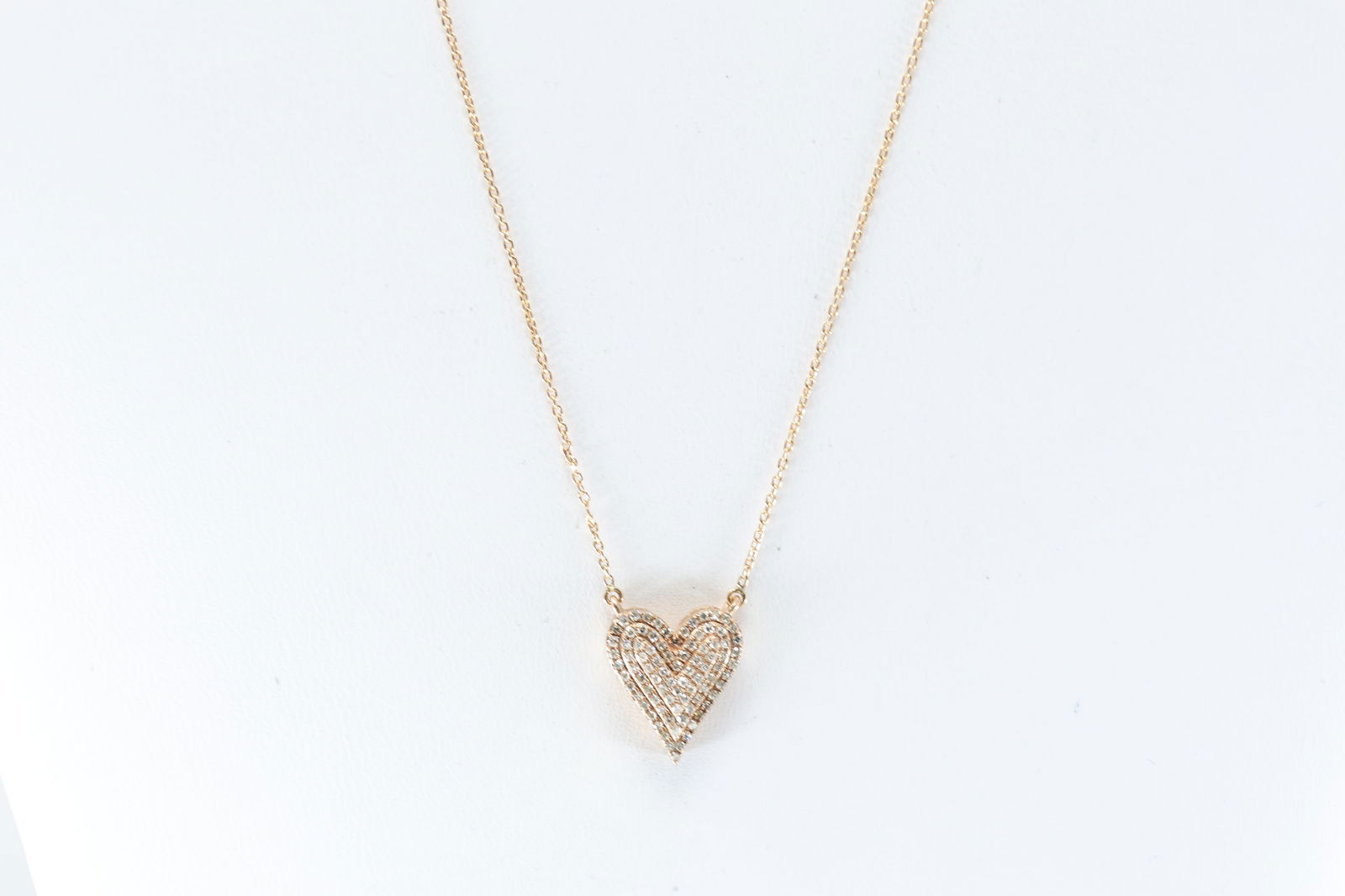 Rose Gold Diamond Heart Necklace .: 10Kt Yellow Gold Diamond Heart Necklace. Necklace has one heart pendant design with round diamonds. Diamonds weight approx: 1.00cttw. Necklace length: 18.00" Total weight: 2.30 grams.