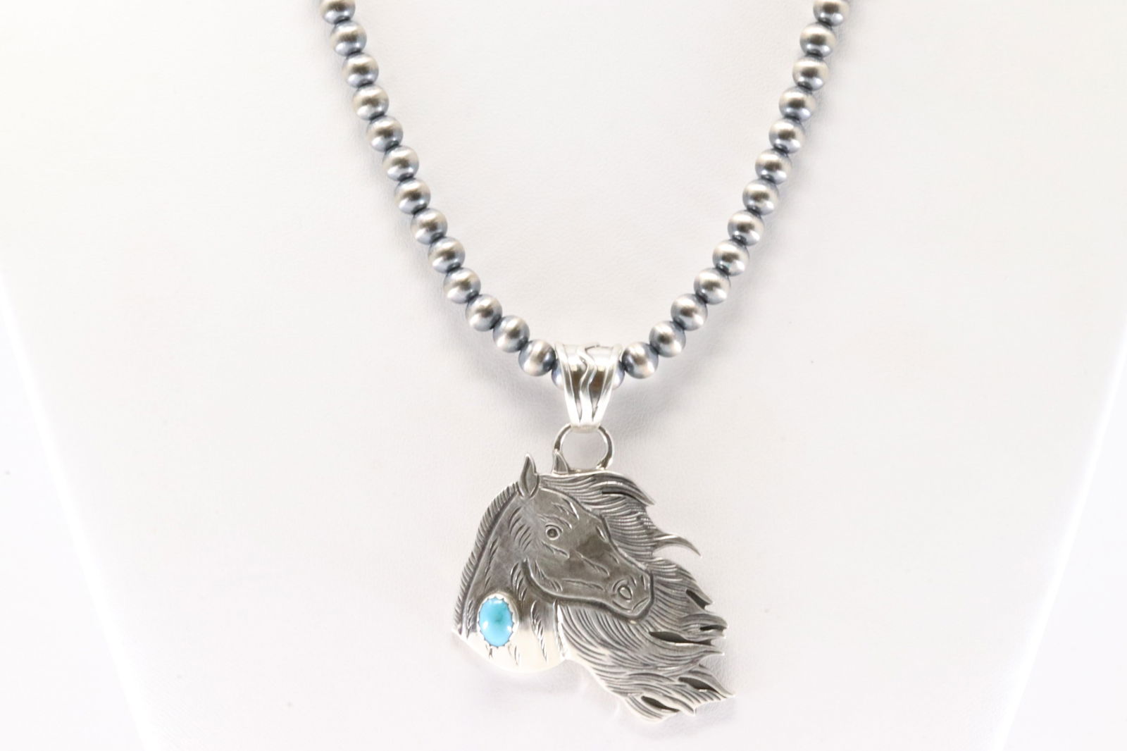 Native America Navajo Sterling Silver Turquoise Horse Head By Jeremy Delgarito. With Machine Made: This is a Native America Navajo Sterling Silver Turquoise Horse Head By Jeremy Delgarito. With Machine Made Pearl Beaded Sterling Silver Necklace. Necklace length: 16.00"