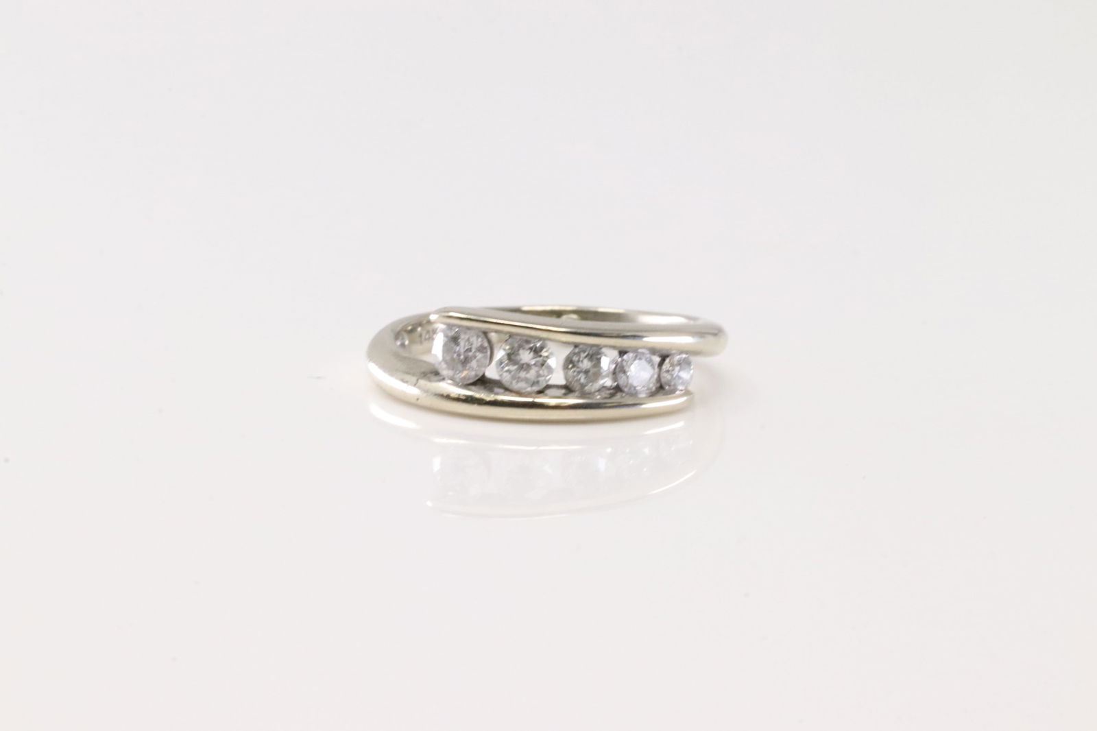 Diamond Ring 14Kt.: Ladies 14Kt White Gold Diamond Ring. This Elegant Ring has 5 Round Sparkling Diamonds. Diamond Weight Approx: 0.40CTW. Ring Size: 4.00. Total Weight: 2.57 Grams.