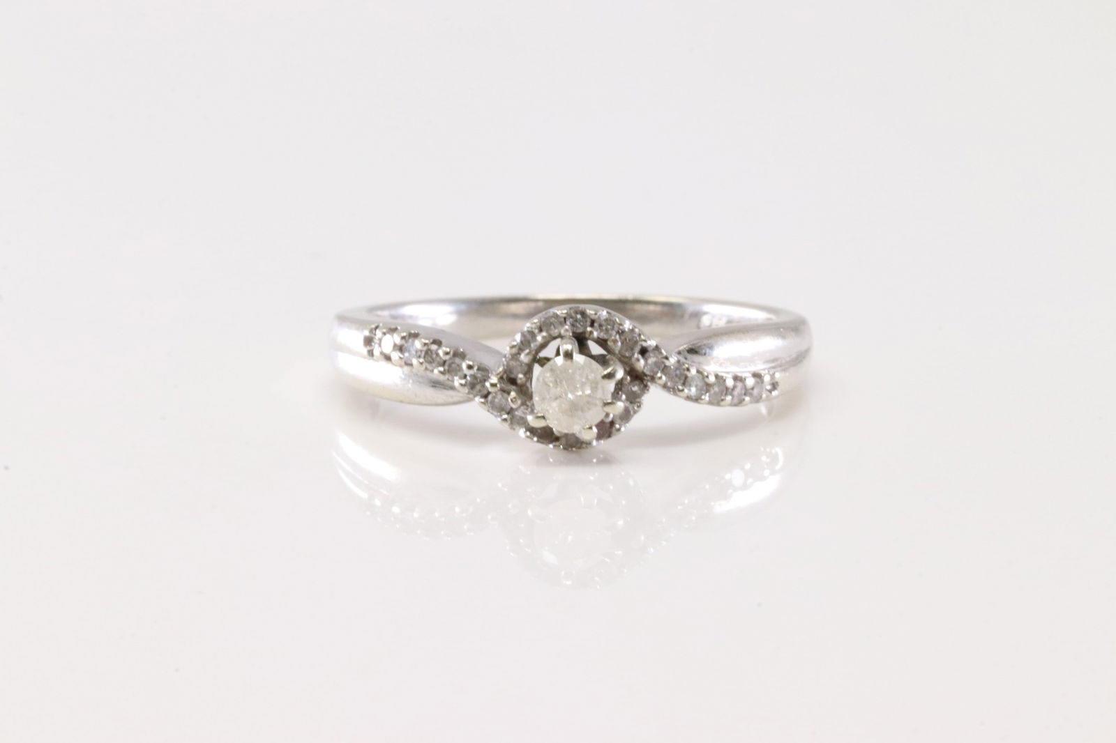 Diamond Ring 10Kt.: Ladies 10Kt White Gold Ring. This Charming Ring has 25 Round Brilliant Diamonds. Diamond Weight Approx: 0.35ctw. Ring Size: 7.00. Total Weight: 2.28. Grams.