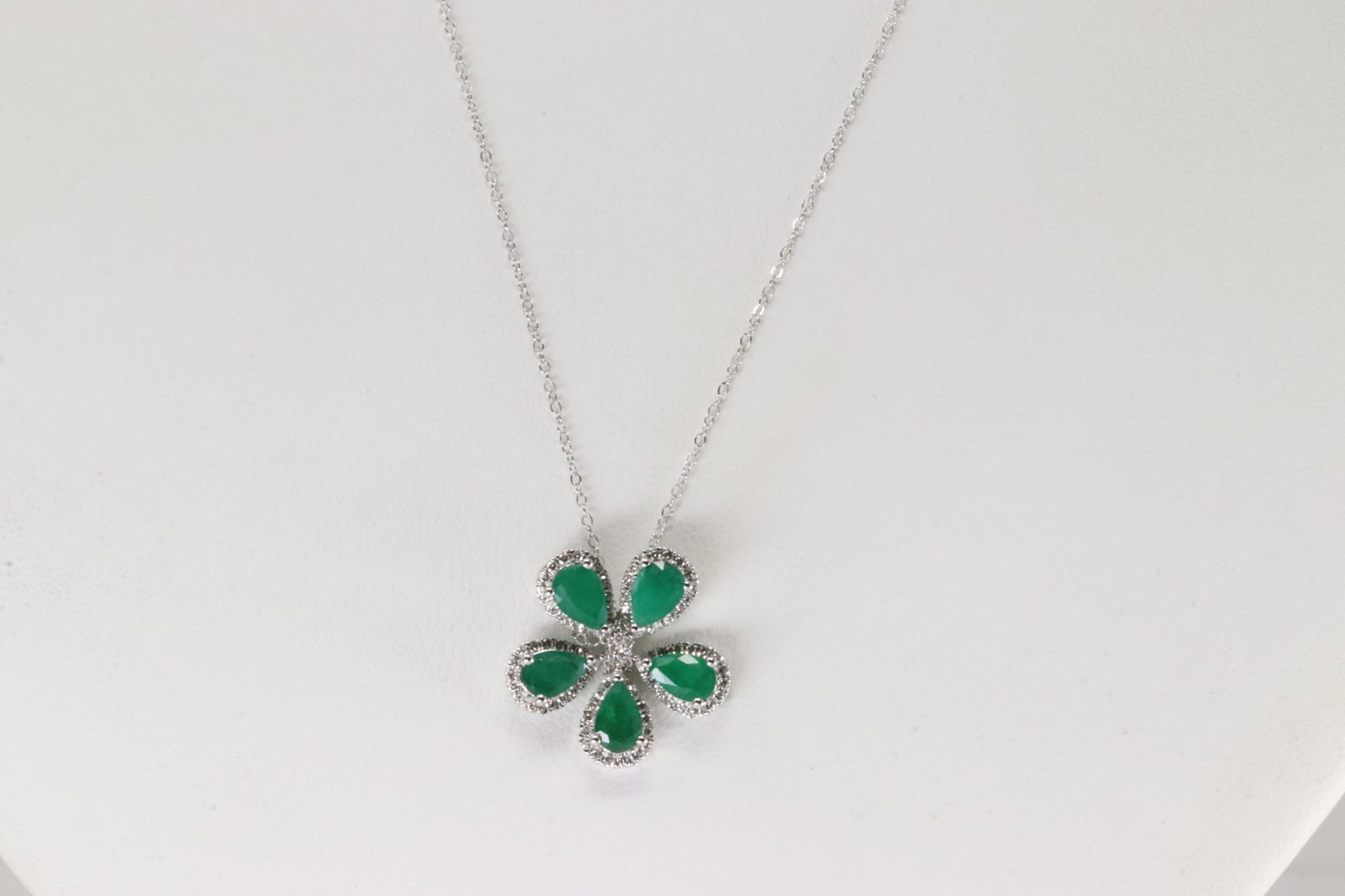 Emerald & Diamond Flower Pendant / Necklace 14Kt.: 14Kt White Gold Emerald & Diamond Flower Pendant / Necklace. This Necklace has Elegant Flower Pendant with 5 Pear-Shape Emeralds and 81 round Diamonds. Necklace length: 20.00" Total weight: 3.70