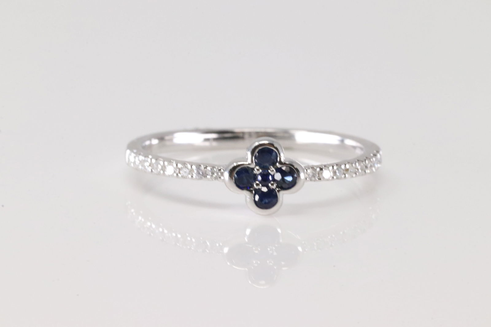 Sapphire & Diamond Flower Ring 14Kt.: Ladies 14Kt White Gold Sapphire & Diamond Flower Ring. This Ring has Flower Design with Sapphires and Sparkling Diamodns. Diamonds weight: 0.10ctw. Sapphire weight: 0.14ctw.
