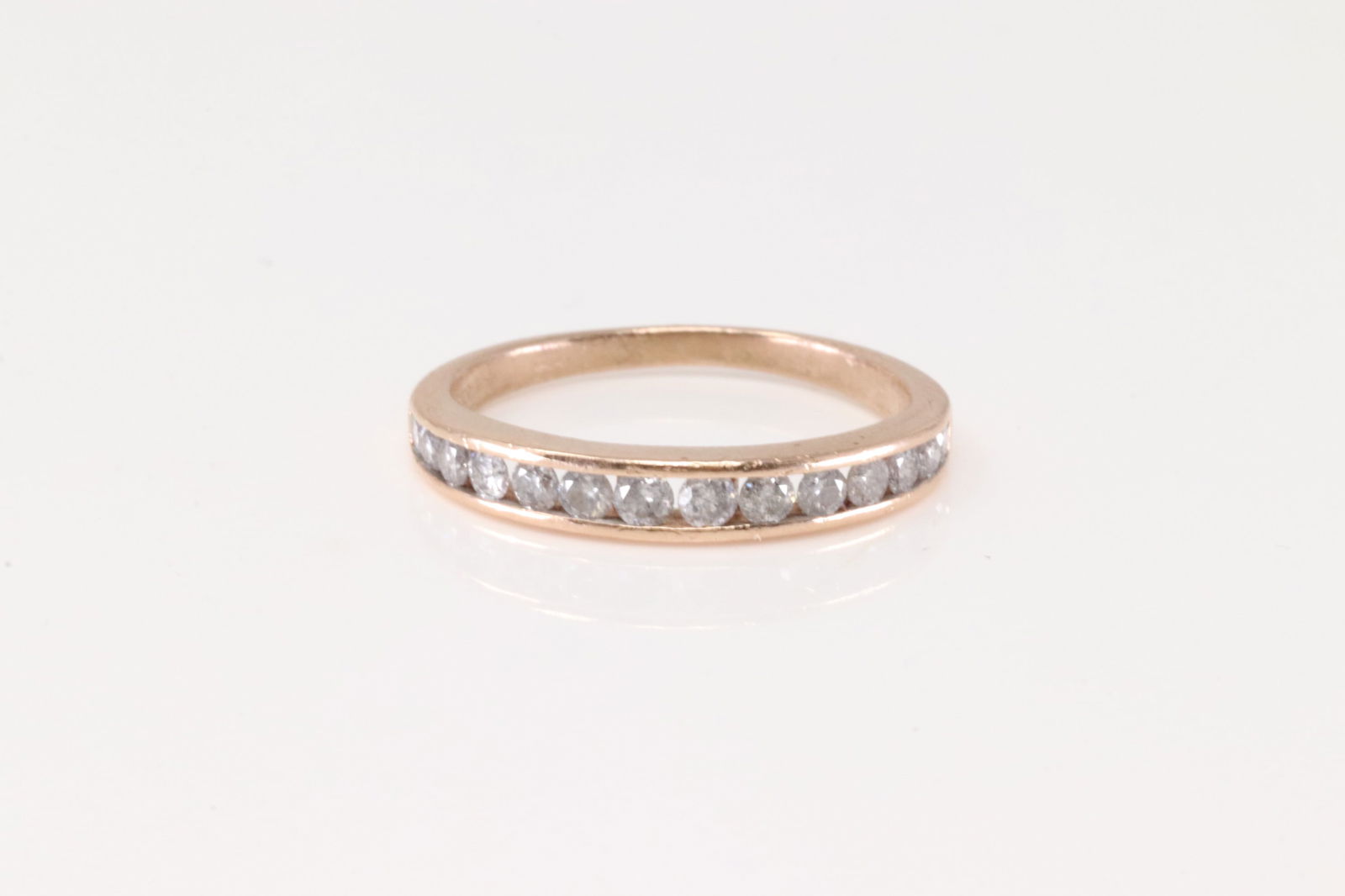 Diamond Ring/Band 10Kt.: Ladies 10Kt Rose Gold Diamond Ring. This Elegant Ring has 14 Round Sparkling Diamonds. Diamond Weight Approx: 0.50ctw. Ring Size: 7.00. Total Weight: 2.05. Grams.