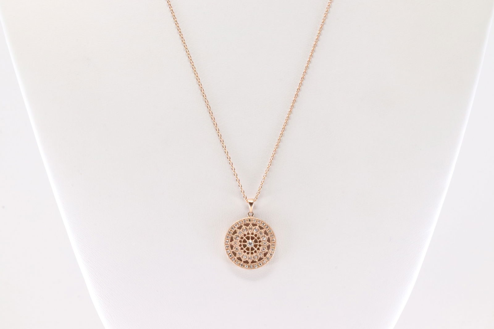 Diamond Pendant / Necklace 14Kt.: 14Kt Rose Gold Diamond Pendant / necklace. This Charming Pendant has Circle Design with 47 round Diamonds & A 14K Necklace. Diamonds weight Approx: Necklace length: 18.00" Total weight: 4.40 Grams.