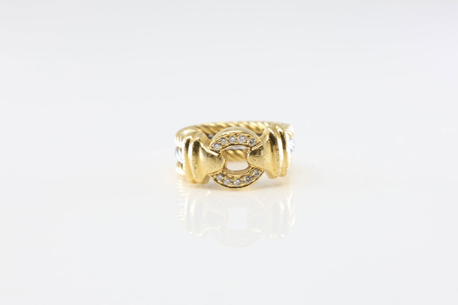 Signed Diamond Ring 18Kt.: Signed 18Kt Yellow Gold Diamond Ring. Ring has a modern style with 10 round sparkling diamonds & a row of steel steen. Diamonds weight approx: 0.35ctw. Ring size: 5.25. Total weight: 9.90 Grams.