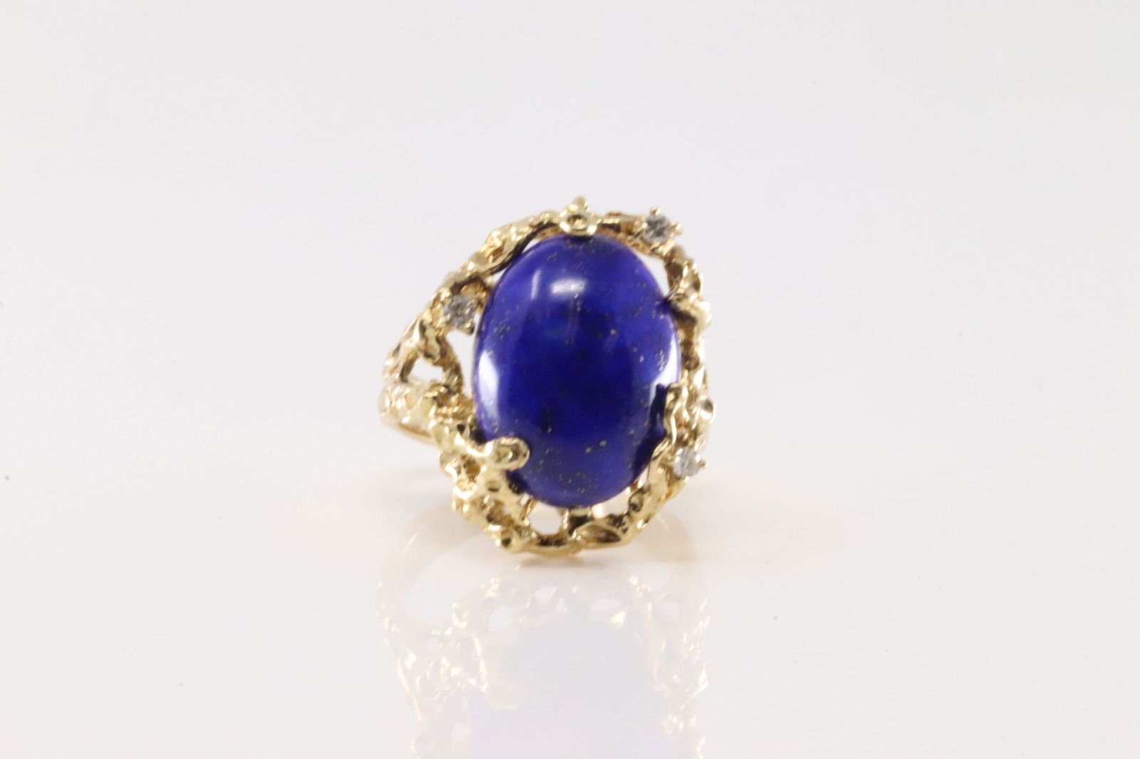 Lapis & Diamond Ring 14Kt.: Ladies 14Kt Yellow Gold Lapis & Diamond Ring. This elegant ring has one blue oval lapis stone with 3 sparkling diamonds. Ring size: 5.25. Total weight: 8.30 Grams.