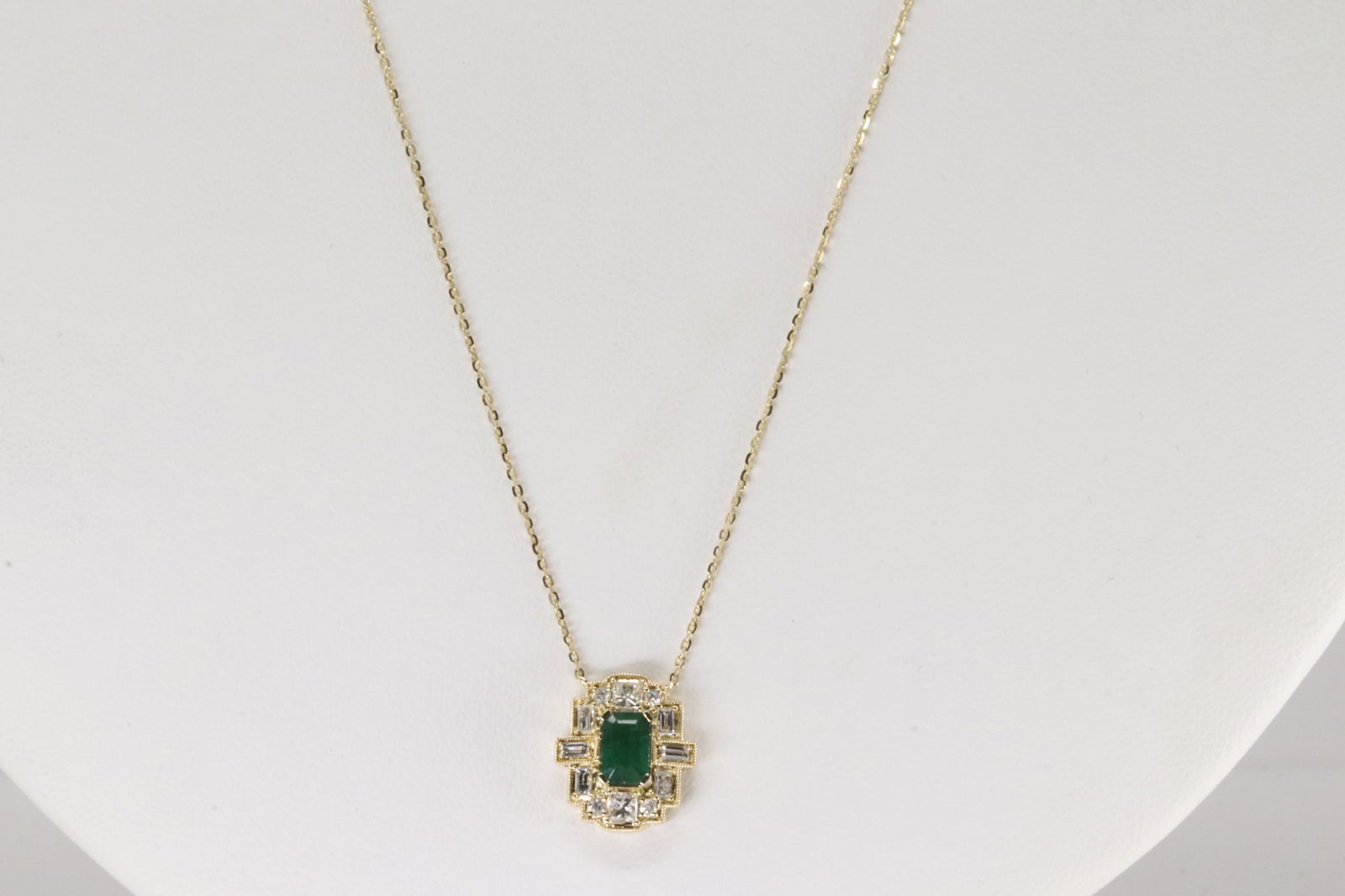 Emerald & Diamond Pendant / Necklace 14Kt.: Ladies 14Kt Yellow Gold Emerald & Diamond Pendant / Necklace. This Necklace has an Charming Pendant with Green Merald on the Center Surrender by Round & Baguette Diamonds. Diamonds weight: 0.34ctw.