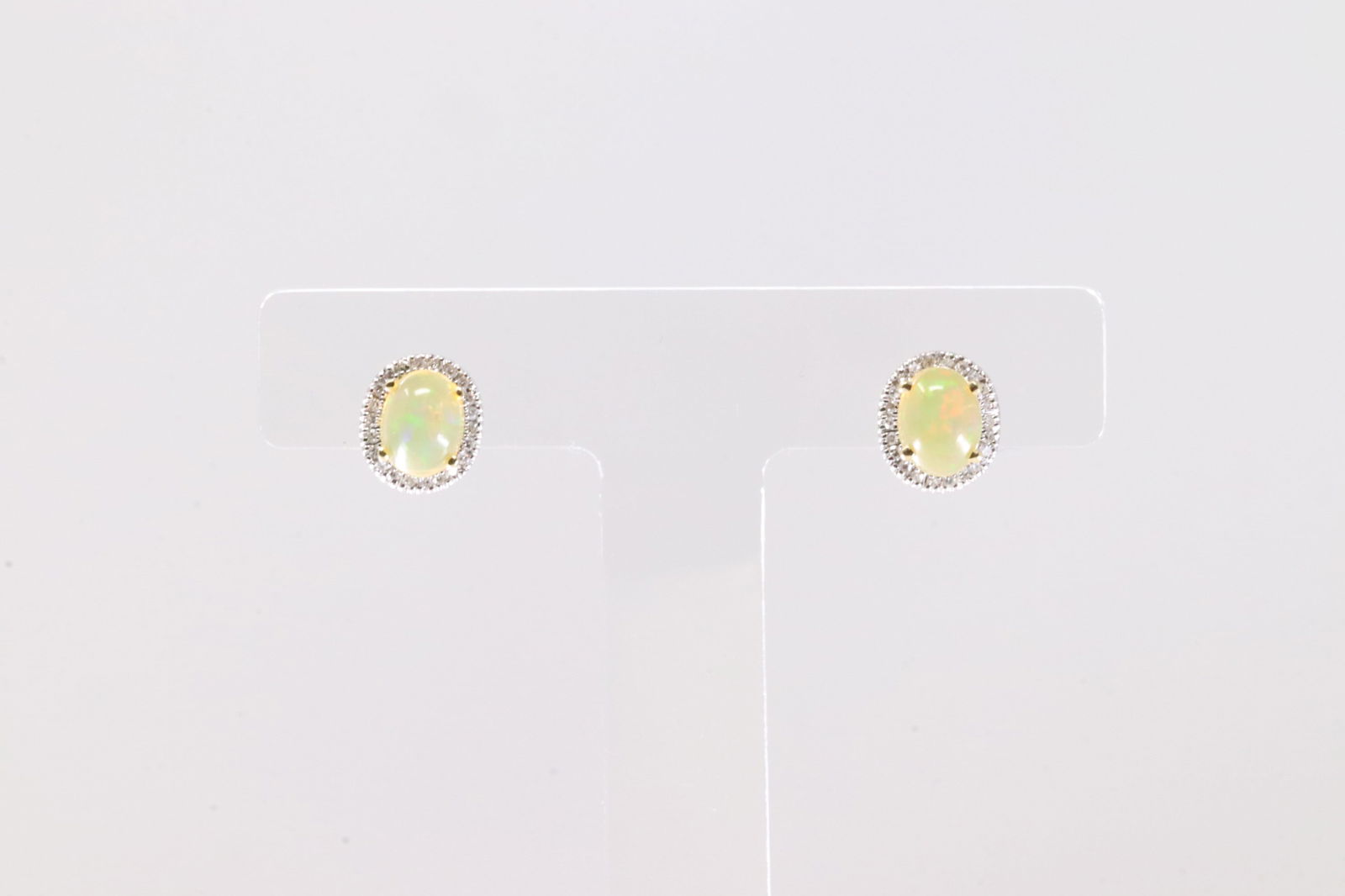 Citrine & Diamond Stud Earring 14Kt.: Ladies 14Kt Yellow Gold Citrine & Diamond Stud Earring. This Elegant Earring's has Oval Citrine Gemstone With 48 Round Sparkling Daimonds. Total Weight: 2.29 Grams.
