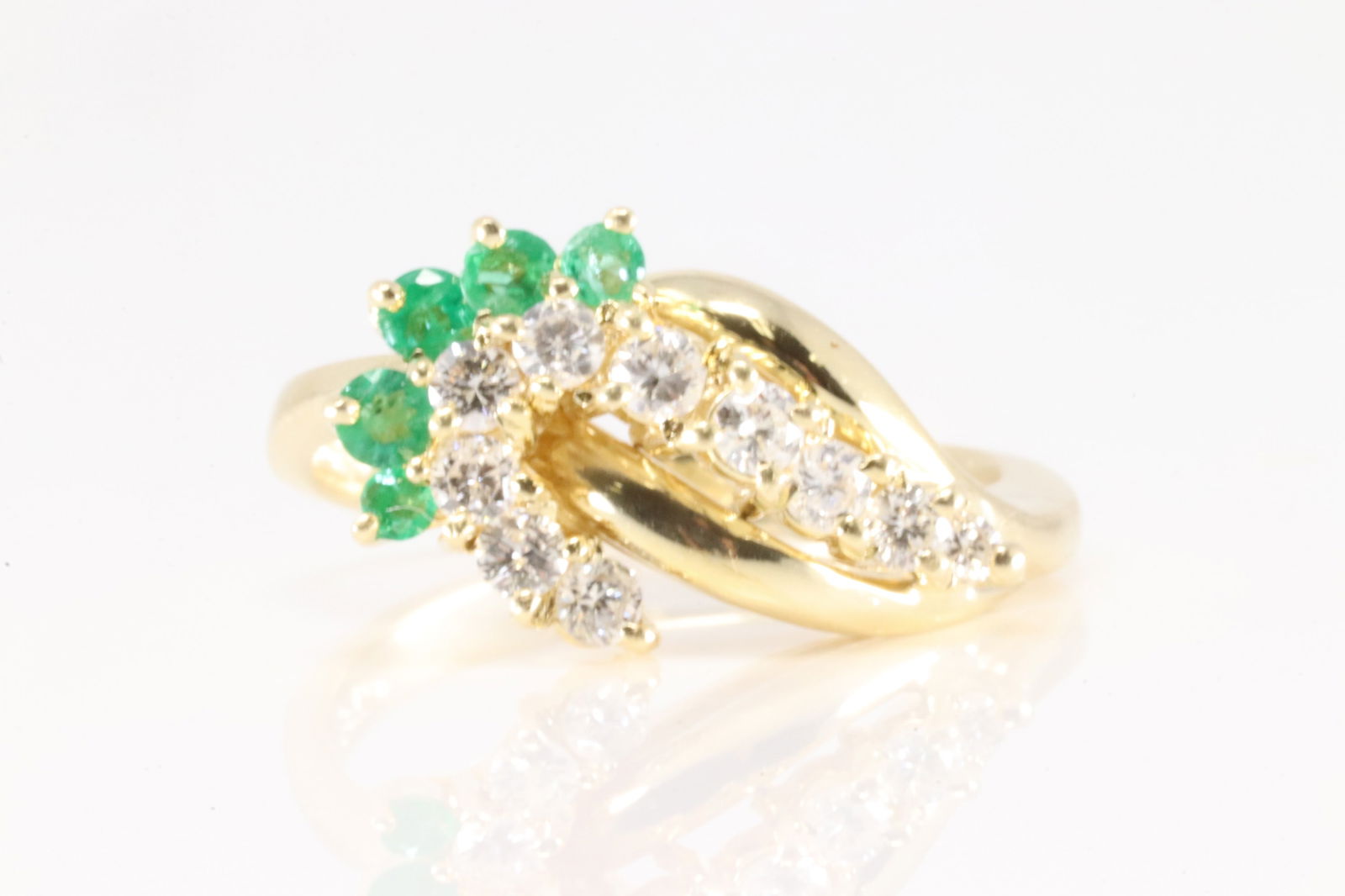 Emerald & Diamond Ring 18Kt.: Ladies 18Kt Yellow Gold Emerald & Diamond Ring. This elegant ring has 10 brilliants round diamonds with 2 round emeralds. Diamonds weight approx: 0.50cttw. Ring size: 6.50. Total weight: 5.90 Grams.