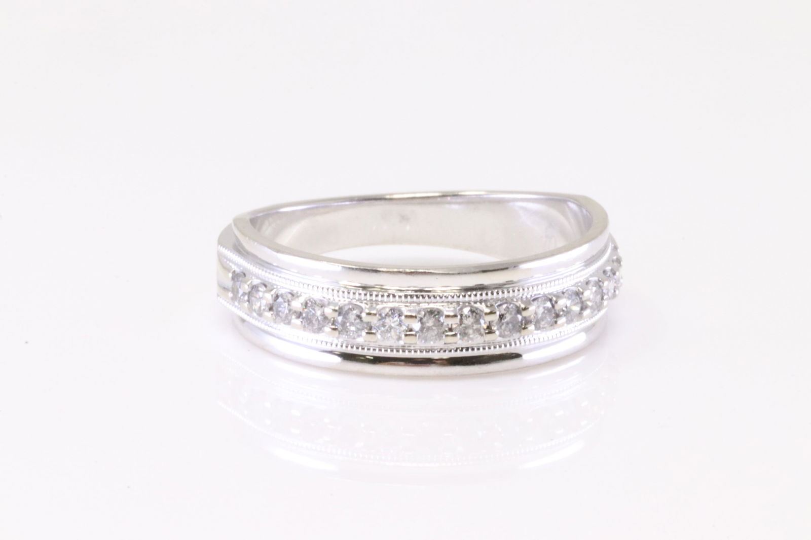 Diamond Wedding Ring 10Kt.: 10Kt White Gold Diamond Wedding Ring. Ring has 15 Diamonds. Diamonds weight approx: 0.25ctw. Ring size: 9.50. Total weight: 5.20 Grams.