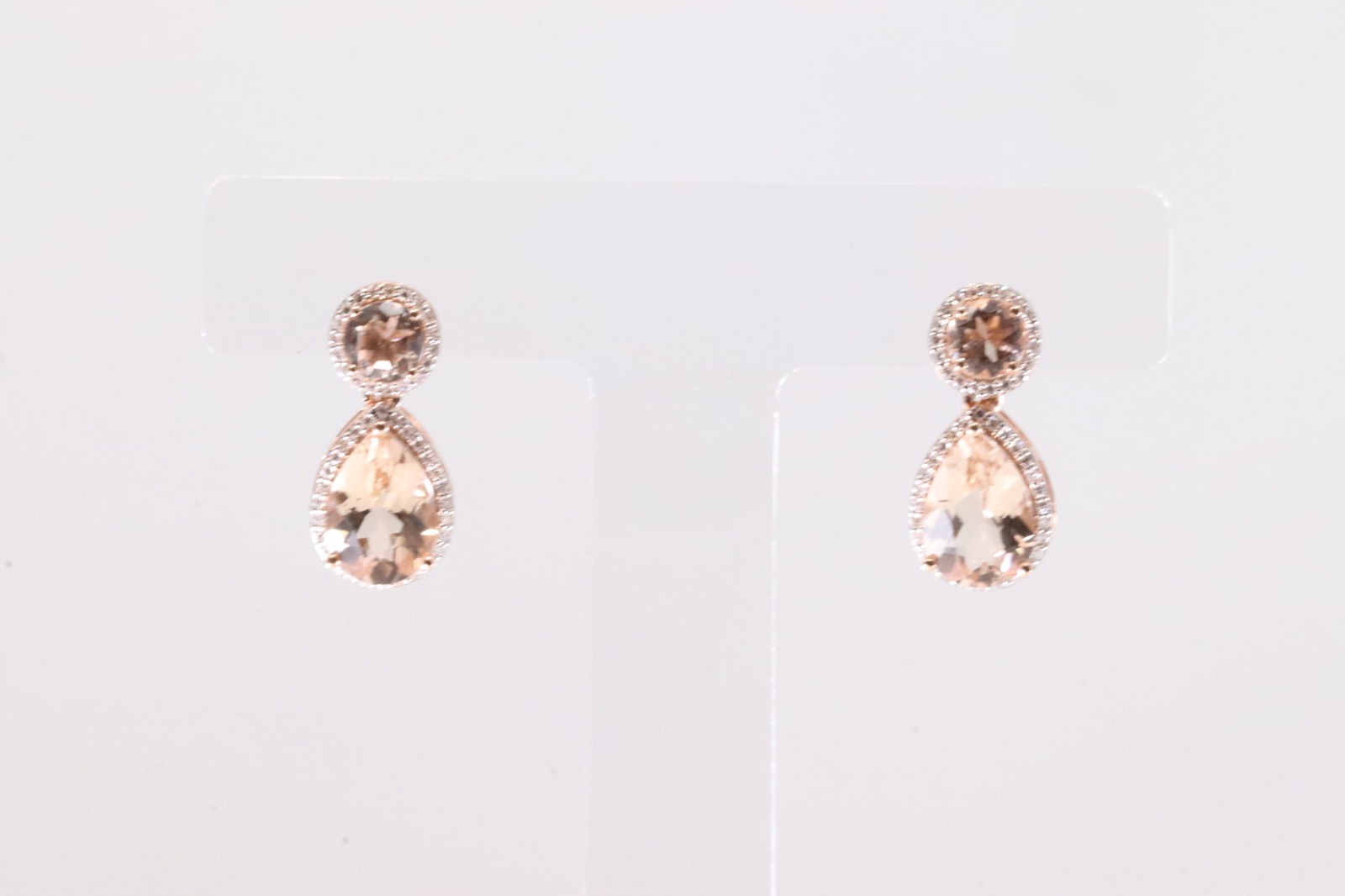 Morganite & Diamond Stud Earring 14Kt.: Ladies 14Kt Rose Gold Morganite & Diamond Stud Earring. This Elegant Earring's has Morganite Gemstones With 100 Round Sparkling Diamonds. Total Weight: 4.47 Grams.