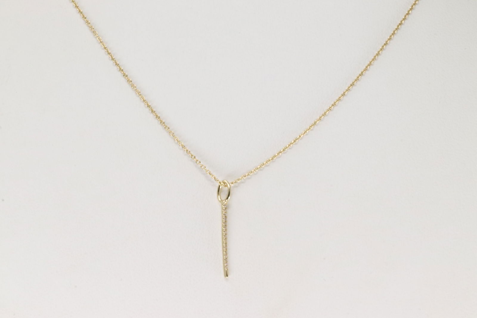 Diamond Needle Pendant / Necklace 14Kt.: 14Kt Yellow Gold Diamond Needle Pendant / Necklace. This Necklace has Needle Pendant with 16 round Diamonds. Diamonds weight:0.03ctw. Necklace length: 20.00"