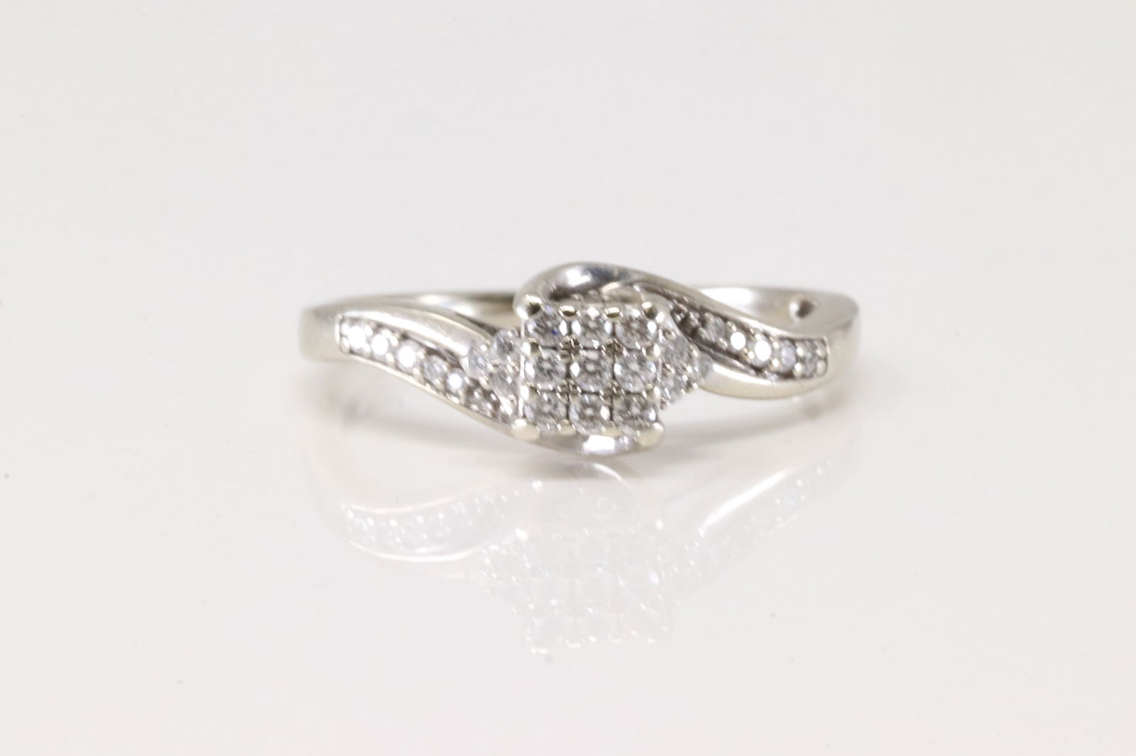 Ladies Diamond Ring 10Kt.: Ladies 10Kt White Gold Diamond Ring. This Elegant Ring has 25 Round Sparkling Diamonds. Diamond Weight Approx: 0.50ctw. Ring Size: 9.50. Total Weight: 3.13 Grams.