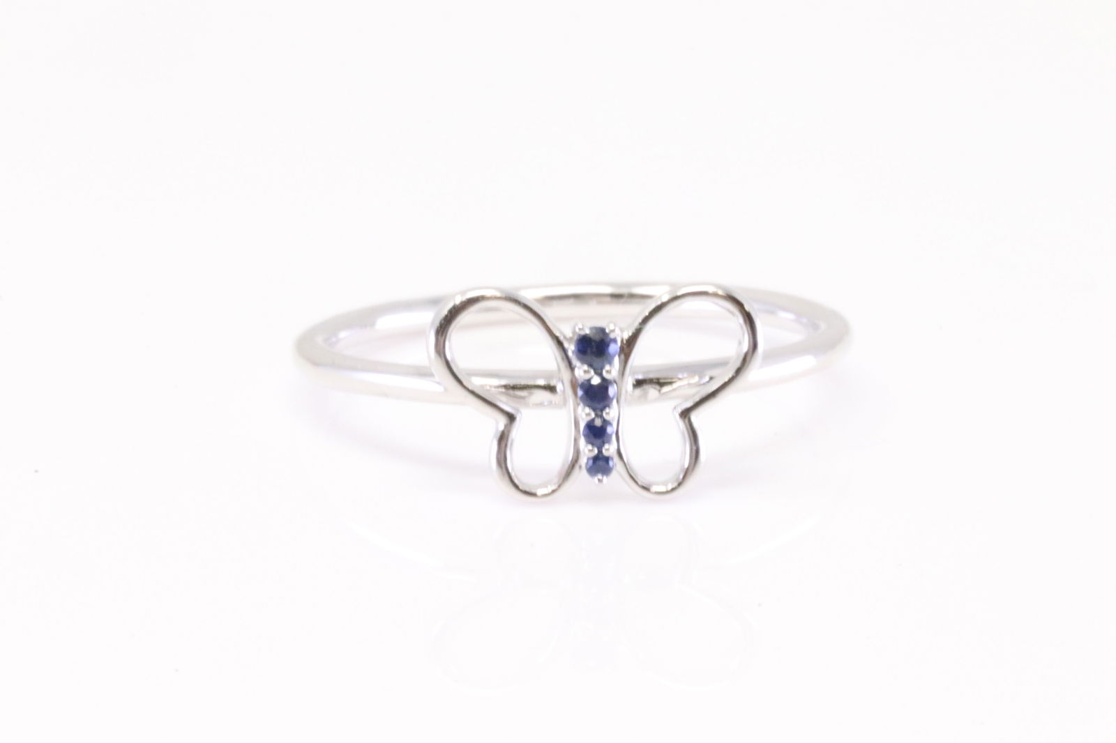 Sapphire Butterfly Ring 10Kt.: Ladies 10Kt White Gold Sapphire Butterfly Ring. Ring has 4 rund Sapphire's. Ring size: 7.00.