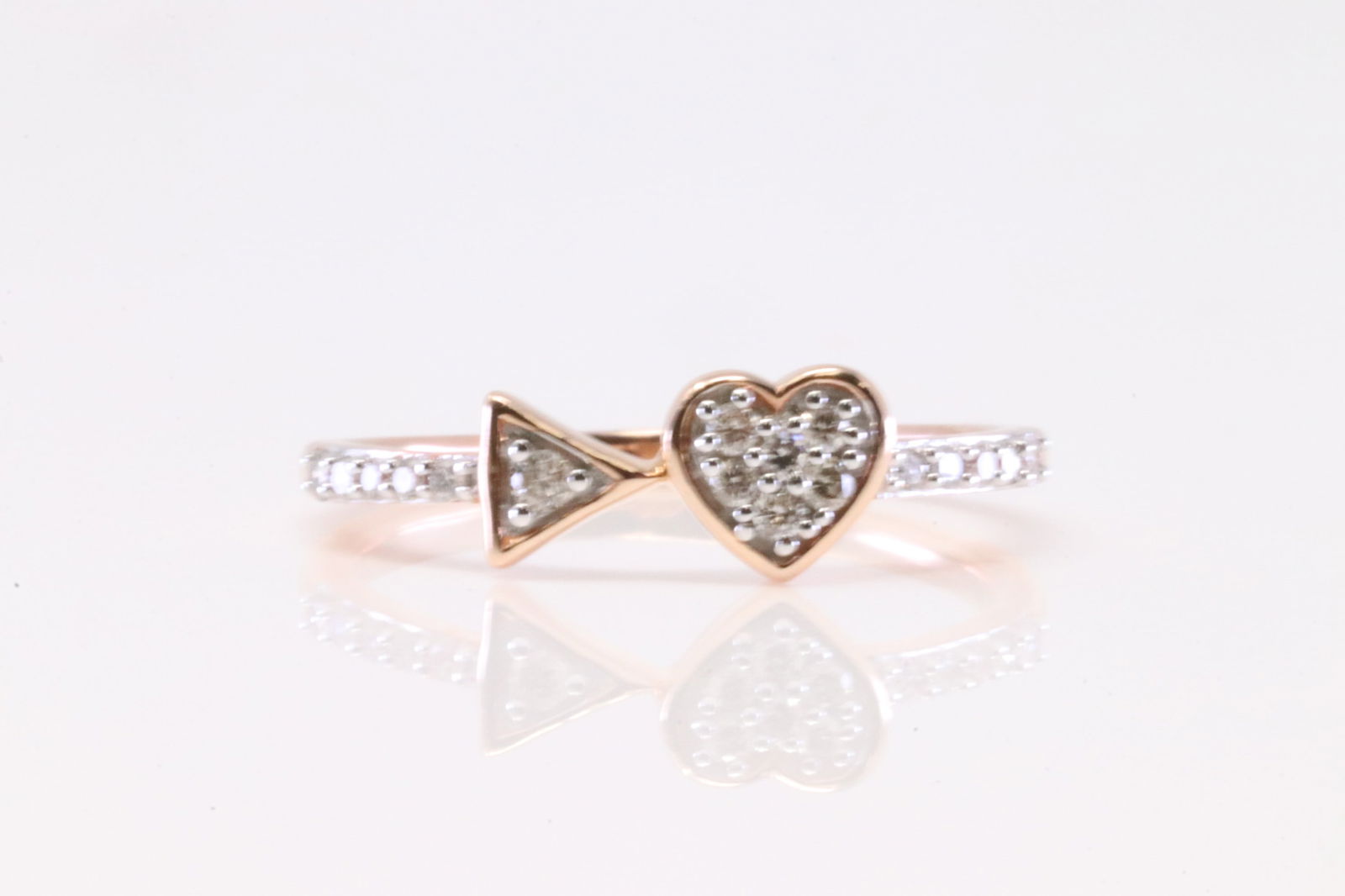 Arrow & Heart Diamond Ring 10Kt.: Ladies 10Kt Rose Gold Arrow & Heart Diamond Ring. Ring has Arrow & Heart Design with round Diamonds. Diamonds weight: 018ctw. Ring size: 5.50.