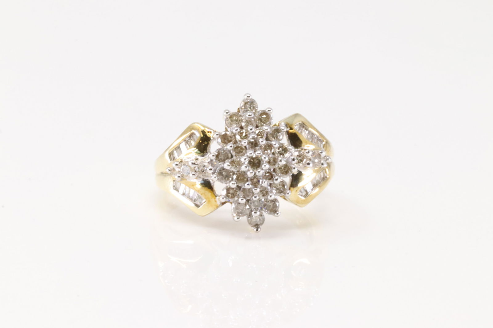 Ladies Cocktail Diamond Ring 10Kt.: Ladies 10Kt Yellow Gold Diamond Ring. This Charming Ring has 35 Round / 20 Baguette Sparkling Diamonds. Diamonds Weight Approx: 1.00ctw. Ring Size: 7.00. Total Weight: 4.33. Grams.