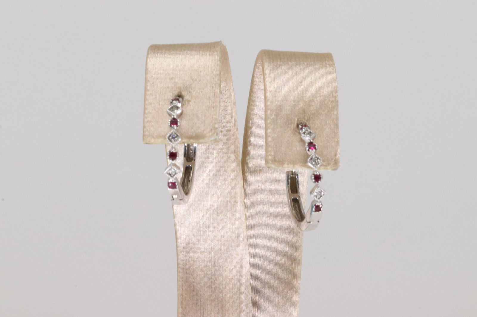 Ruby & Diamond Hoop Earring 14k.: Ladies 14kt White Gold Ruby & Diamond Earring's. Gorgeous Sparkling Diamond Earring's With Ruby Gem. Diamond Weight: 0.15ct.