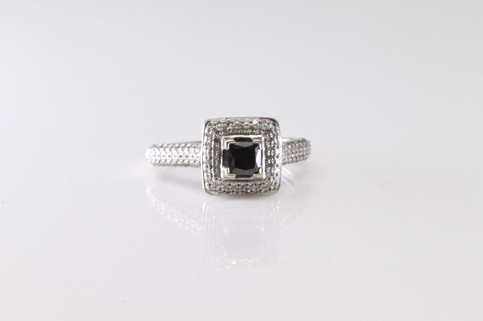 Black Onyx & Diamond Ring 14Kt.: Ladies 14Kt White Gold Black Onyx & Diamond Ring. This Charming Ring has A Black Onyx Gemstone With 109 Round Sparkling Diamonds. Ring Size: 6.50. Total Weight: 3.40 Grams.