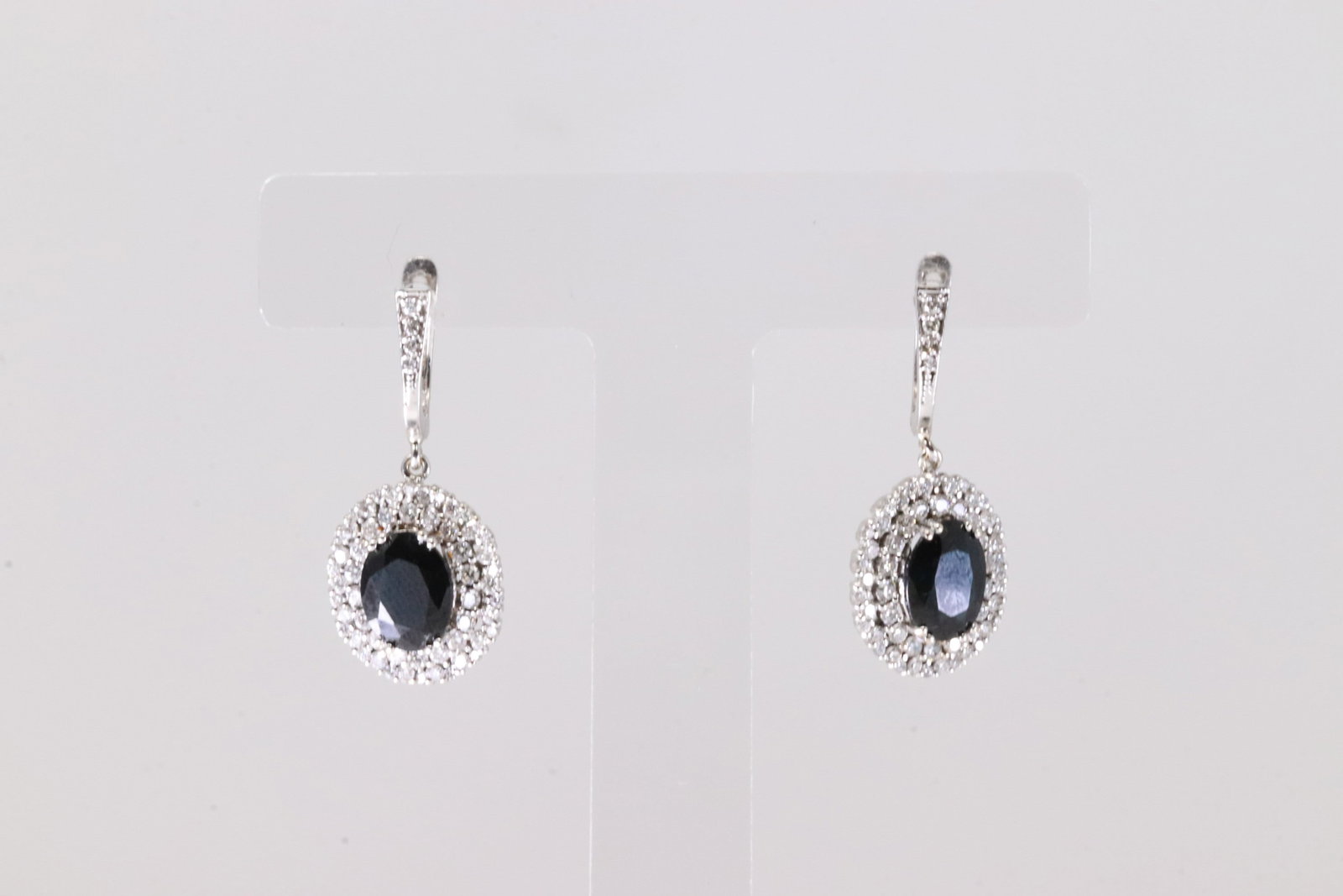 Black Onyx & Diamond French Hoop Earring 18Kt.: Ladies 18Kt White Gold Black Onyx & Diamond French Hoop Earring. This Elegant Earring's has Black Onyx & 116 Round Sparkling Diamonds. Diamond Weight Approx: 2.30 ctw Total Weight: 6.19 Grams.