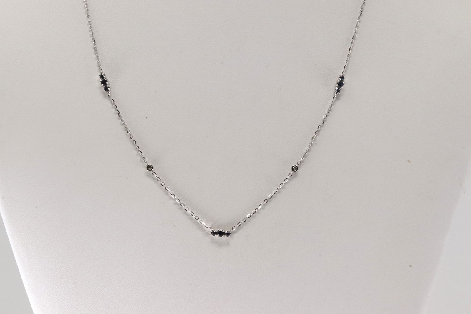 Sapphire & Diamond Necklace 14Kt.: 14kt White Gold Sapphire & Diamond Necklace. This Charming Necklace has Blue Sapphires with Sparkling Diamonds. Diamonds weight: 0.03ctw. Sapphires weight: 0.23ctw. Necklace length: 18.00"